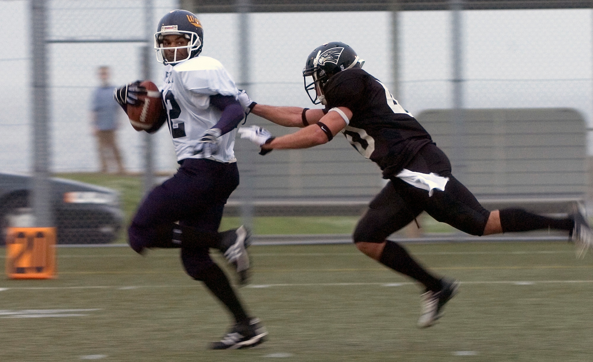 YOKOSUKA NAVAL BASE, Japan -- Yokota Warriors' wide receiver Tyson Huff gets caught from behind on a big gain during the first quarter of Yokosuka's 41-12 win over the Warriors May 30 in U.S. Forces Japan-American Football League action. The Seahawks improved to 3-0 on the season, while Yokota fell to 0-3. The Warriors' final two home games at Bonk Field are set for 5 p.m. June 6 vs. Misawa and 4 p.m. June 27 vs. Kadena. (U.S. Air Force photo/Master Sgt. Matt Summers)