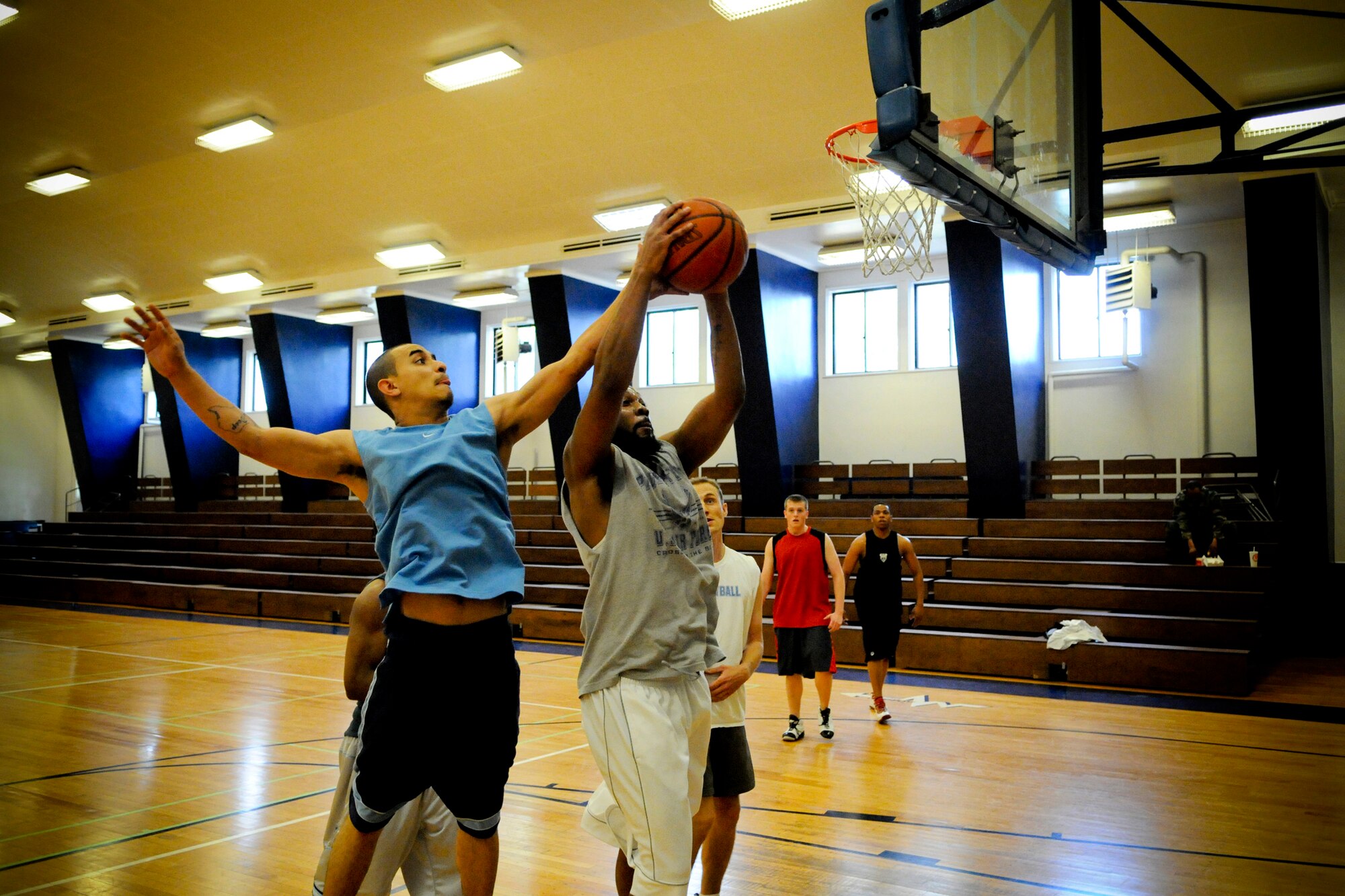 MISAWA AIR BASE, Japan -- Ricardo Perez, left, and Derreck Curtis, right, battle for a rebound during a 3-on-3 basketball tournament at the Potter Fitness Center May 27, 2009. Perez's team finished the tournament in third place while Curtis' team took top honors. (U.S. Air Force photo by Senior Airman Jamal D. Sutter)