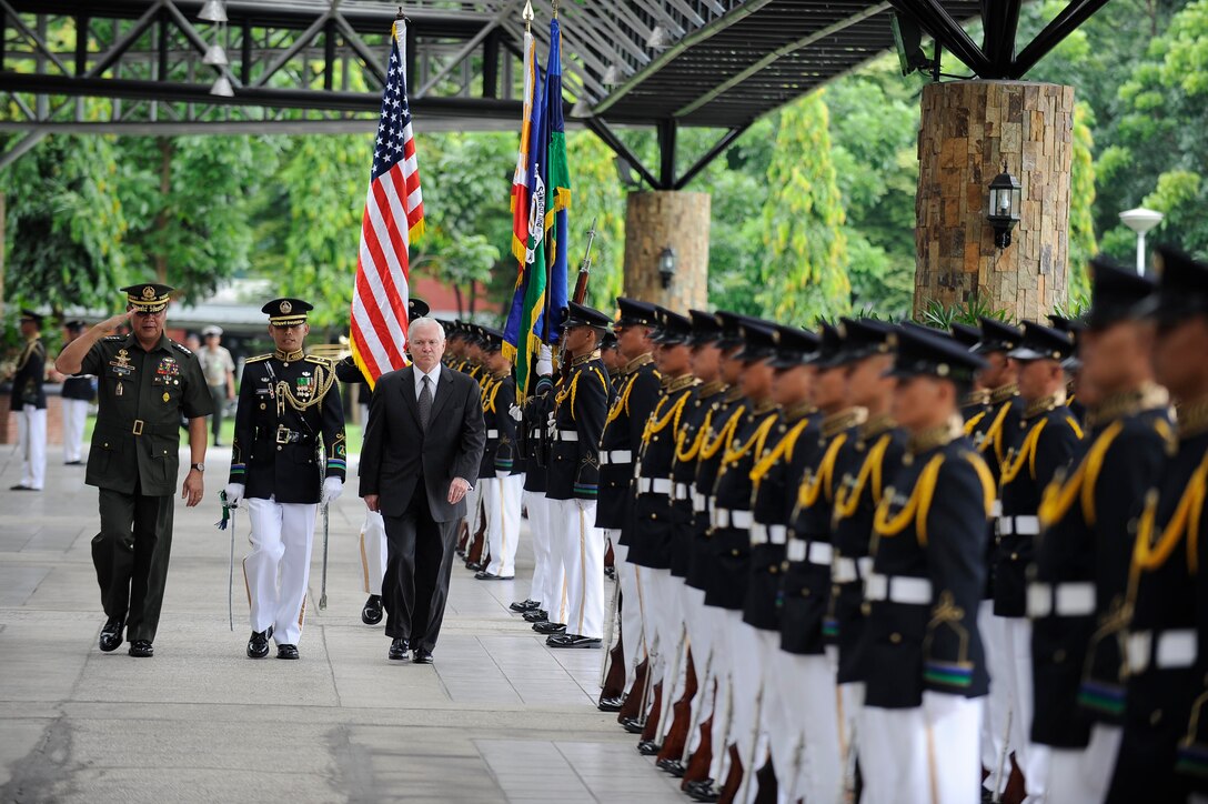 U.S. Defense Secretary Robert M. Gates reviews the troops on Camp Aguinaldo, the national headquarters of the Armed Forces of the Philippines in Manila, Philippines, June 1, 2009.