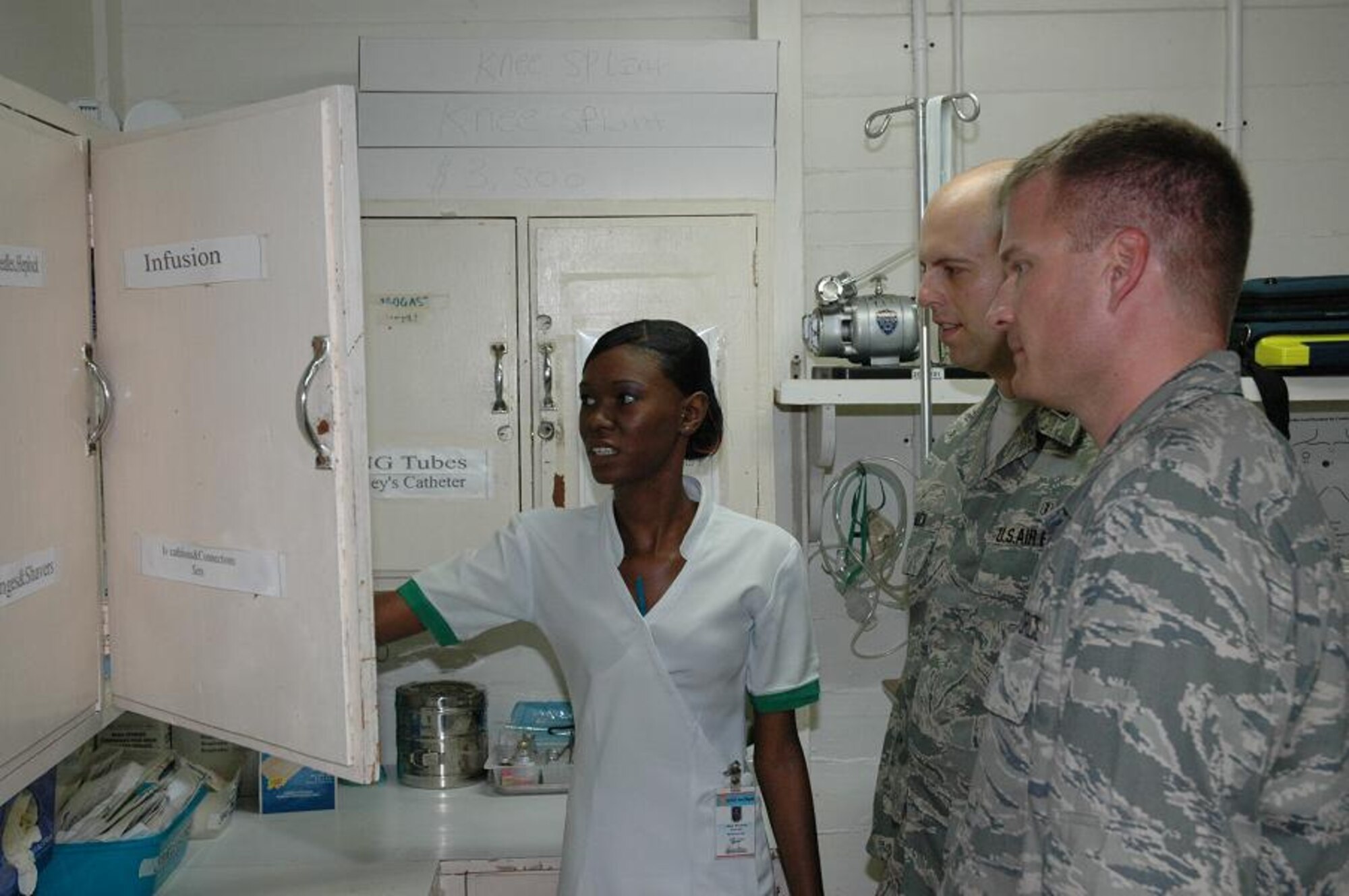 GEORGETOWN, Guyana -- Alicia Moinson, an emergency room nurse at Georgetown's Mercy Hospital, explains types of medical equipment available during
emergencies to Dr. (Capt.) Andrew Muck, inset and Dr. (Capt.) Adam Balls during a hospital tour Monday. (U.S. Air Force photo by Kevin Walston)
