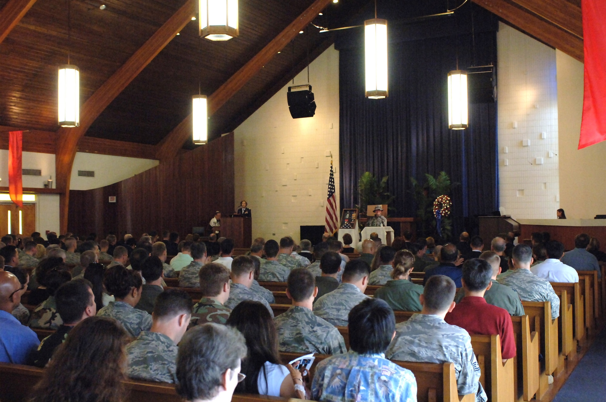 HICKAM AIR FORCE BASE, Hawaii?Hundreds of Airmen and friends attend a memorial service here June 2 at the Hickam Chapel in honor of 1st Lt.  Roslyn Schulte. Lieutenant Schulte died on May 20 from an improvised explosive device while deployed to Afghanistan in support of Operation Enduring Freedom. Lieutenant Schulte, who was assigned to the 613th Air and Space Operations Center, 13th Air Force here,  is a native of St. Louis, Mo., and is survived by her parents Mr. Robert and Susie Schulte, and brother Todd Schulte. (U.S. Air Force photo/ by Oscar A. Hernandez)