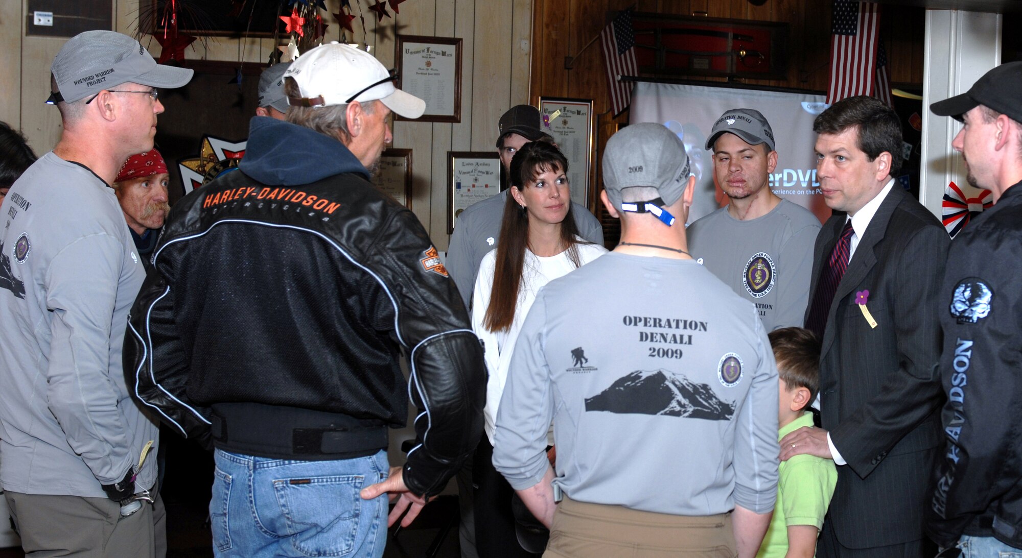 ANCHORAGE, Alaska -- U.S. Senator Mark Begich talks to the Operation Denali team before the presentation ceremony here May 30. Operation Denali is enabling wounded warriors to overcome combat injuries by climbing Mount McKinley, North America's highest peak, while symbolizing the strength of the nation and its defenders. (U.S. Air Force photo/Tech. Sgt. Brian Smith)