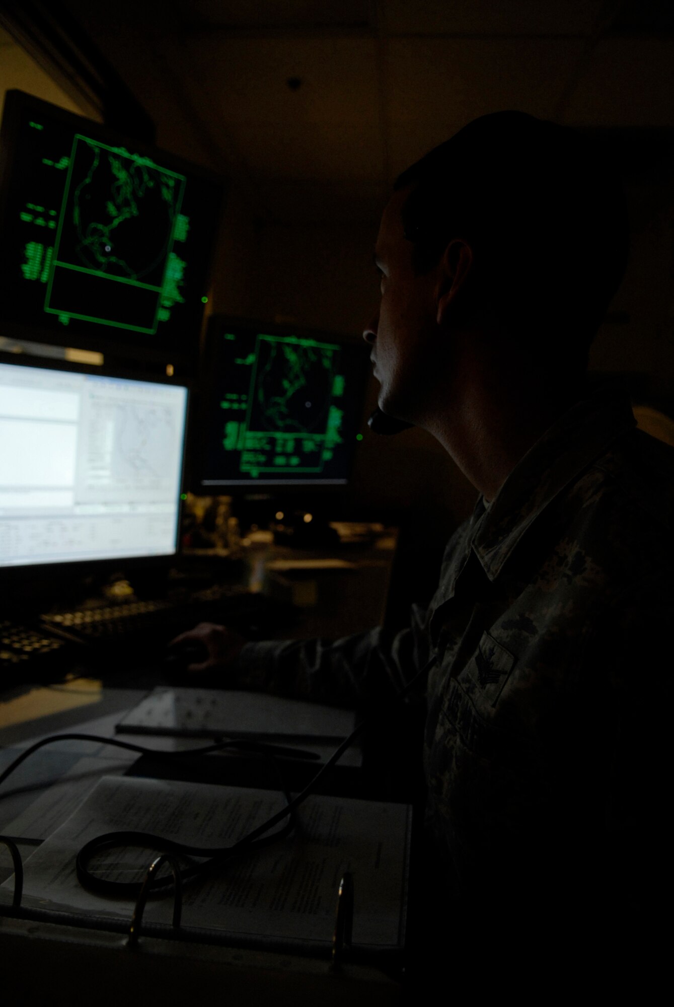 VANDENBERG AIR FORCE BASE, Calif. -- Working with multiple sources of input, Tech. Sgt Cody Nolen, a 533rd Training Squadron global positioning system instructor, trains early orbit determination for paused array warning systems using several computer monitors May 28. The 533rd TRS, an original missile squadron and a training detachment at Schriever AFB, Colo., provides initial qualification training for attack warning, space surveillance and counter-drug missions. (U.S. Air Force photo/Senior Airman Christian Thomas)