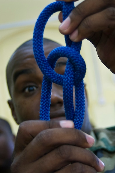 Constable Issac Gustav of the Royal St. Lucia police force's special service unit successfully ties a figure eight  knot during a subject matter expert exchange on basic rappelling for Operation Southern Partner June 1 in La Toc, St. Lucia.  (U.S. Air Force photo/Staff Sgt. Bennie J. Davis III)