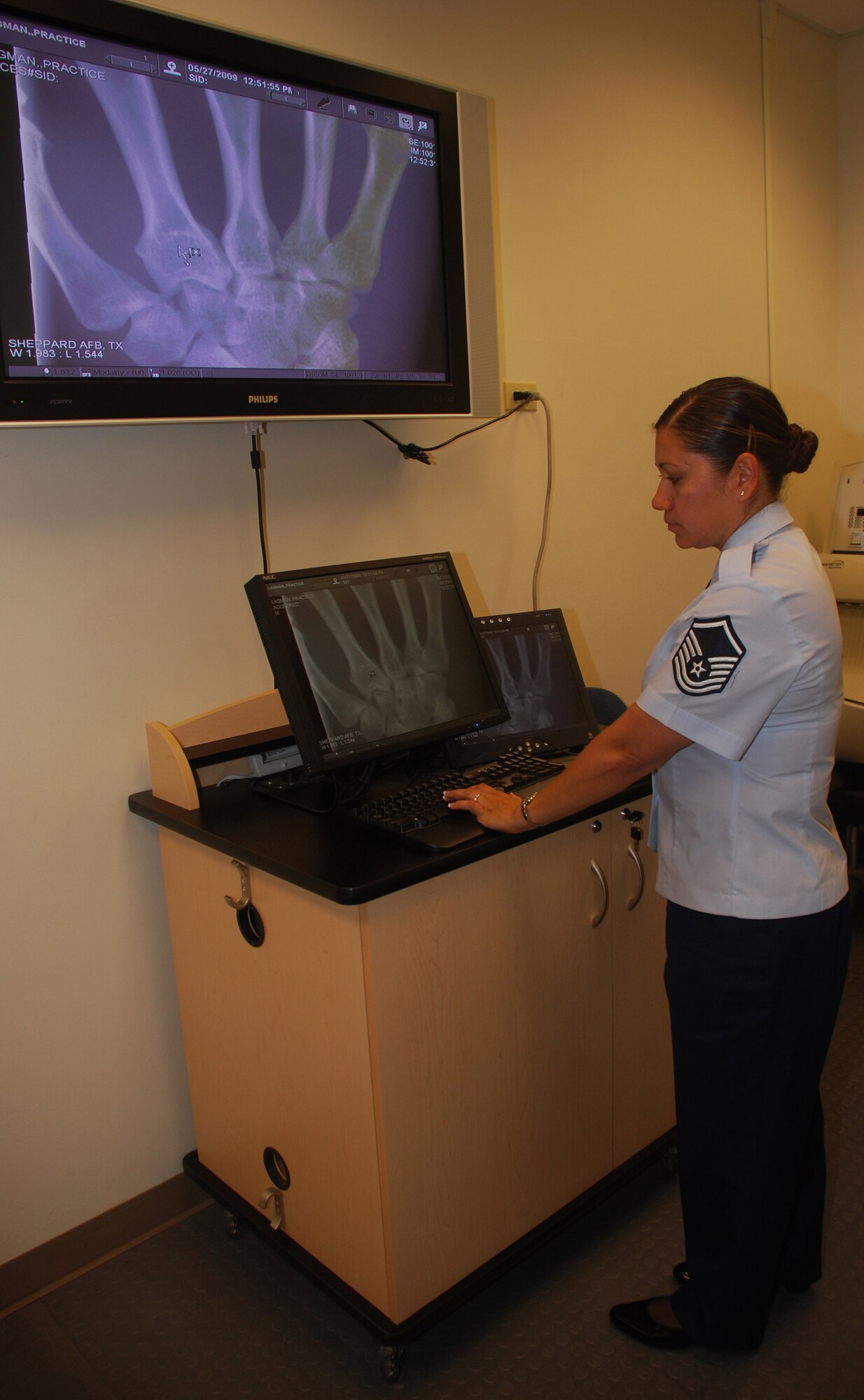 Master Sgt. Erica Perez looks at a digital image of a hand June 1 at the 382nd Training Squadron's radiology and digital imagery lab. Air Education and Training Command selected Sergeant Perez as the command's 2009 National Organization for Mexican American Rights Meritorious Service Award winner. The sergeant will now compete against command winners at the Air Force level. (U.S. Air Force photo/John Ingle)
