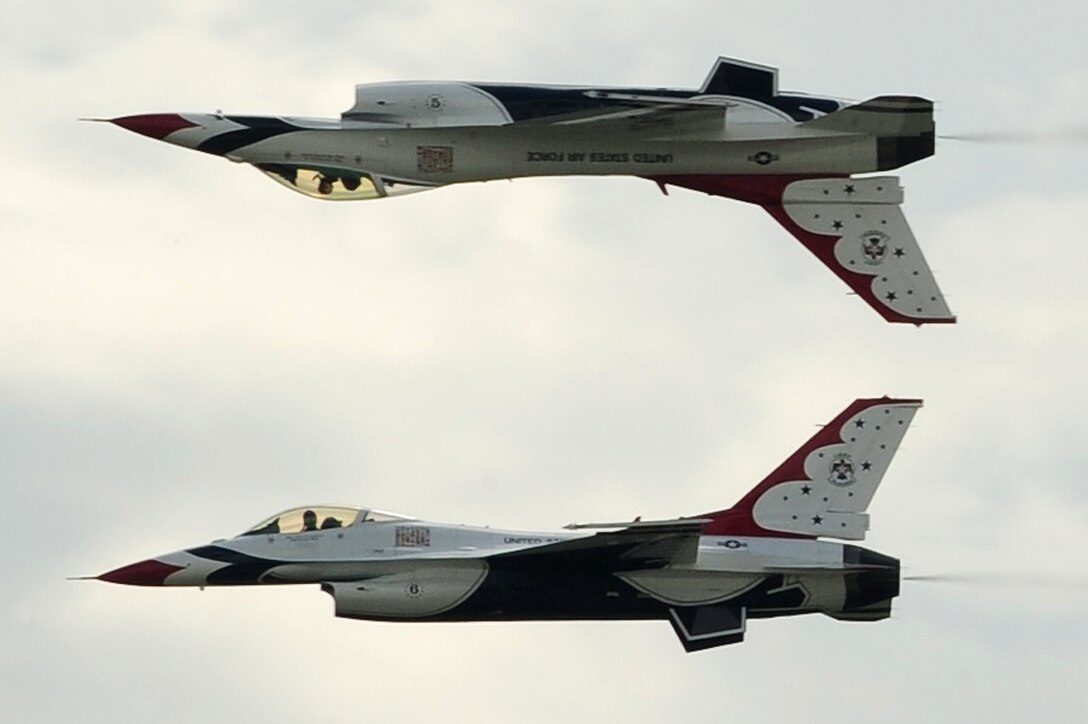 Thunderbirds No. 5 and 6, perform the calypso maneuver during the 2009 Dakota Thunder open house and air show here, May 30. The Thunderbirds are scheduled to perform in more than 70 shows in the United States, Puerto Rico and the Far East.(U.S. Air Force photo/Senior Airman Anthony Sanchelli)