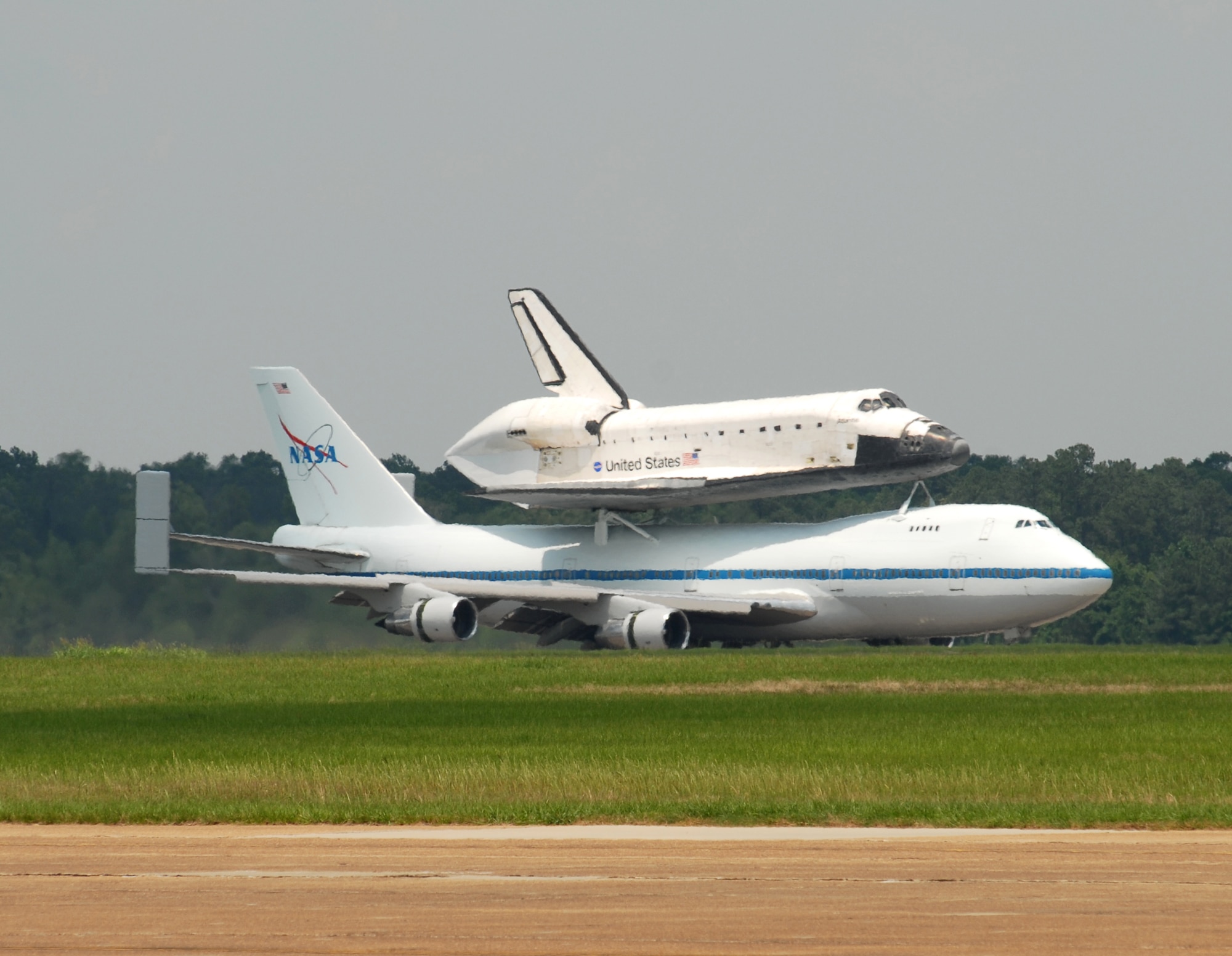 The Space Shuttle Atlantis, riding atop a modified Boeing 747 Shuttle Carrier Aircraft, taxis after landing at Columbus Air Force Base June 2. Columbus AFB was the shuttle’s final stop for fuel before finishing its journey to Kennedy Space Center, Fla. (U.S. Air Force photo/Mary Crump). 