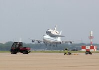 A modified Boeing 747 Shuttle Carrier Aircraft carrying the space shuttle Atlantis lands at Lackland's Kelly Field Annex June 2 to refuel. The shuttle was on its way back to NASA's Kennedy Space Center in Florida. (U.S. Air Force photo/Alan Boedeker)                                  