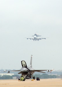 A modified Boeing 747 Shuttle Carrier Aircraft carrying the space shuttle Atlantis lands at Lackland's Kelly Field Annex June 2 to refuel. The shuttle was on its way back to NASA's Kennedy Space Center in Florida. (U.S. Air Force photo/Alan Boedeker)   