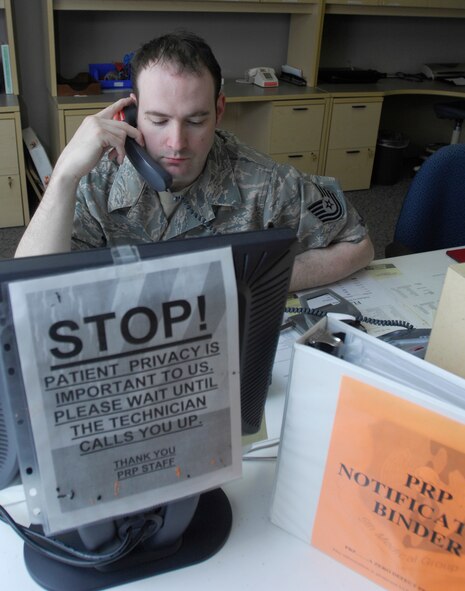 MINOT AIR FORCE BASE, N.D. -- Tech. Sgt. William Lewis, a medical technician in the Personal Reliability Program clinic here schedules an appointment for a patient May 28. The program is designed to ensure that each member who performs duties involving nuclear weapons meet certain criteria to guarantee the safety, security and reliability of nuclear asset.  Due to the programs strict guidelines Airmen on PRP status must see specialized doctors than others whom are not on PRP. ( U.S. Air force Photo by Staff Sgt. Stacy Moless)