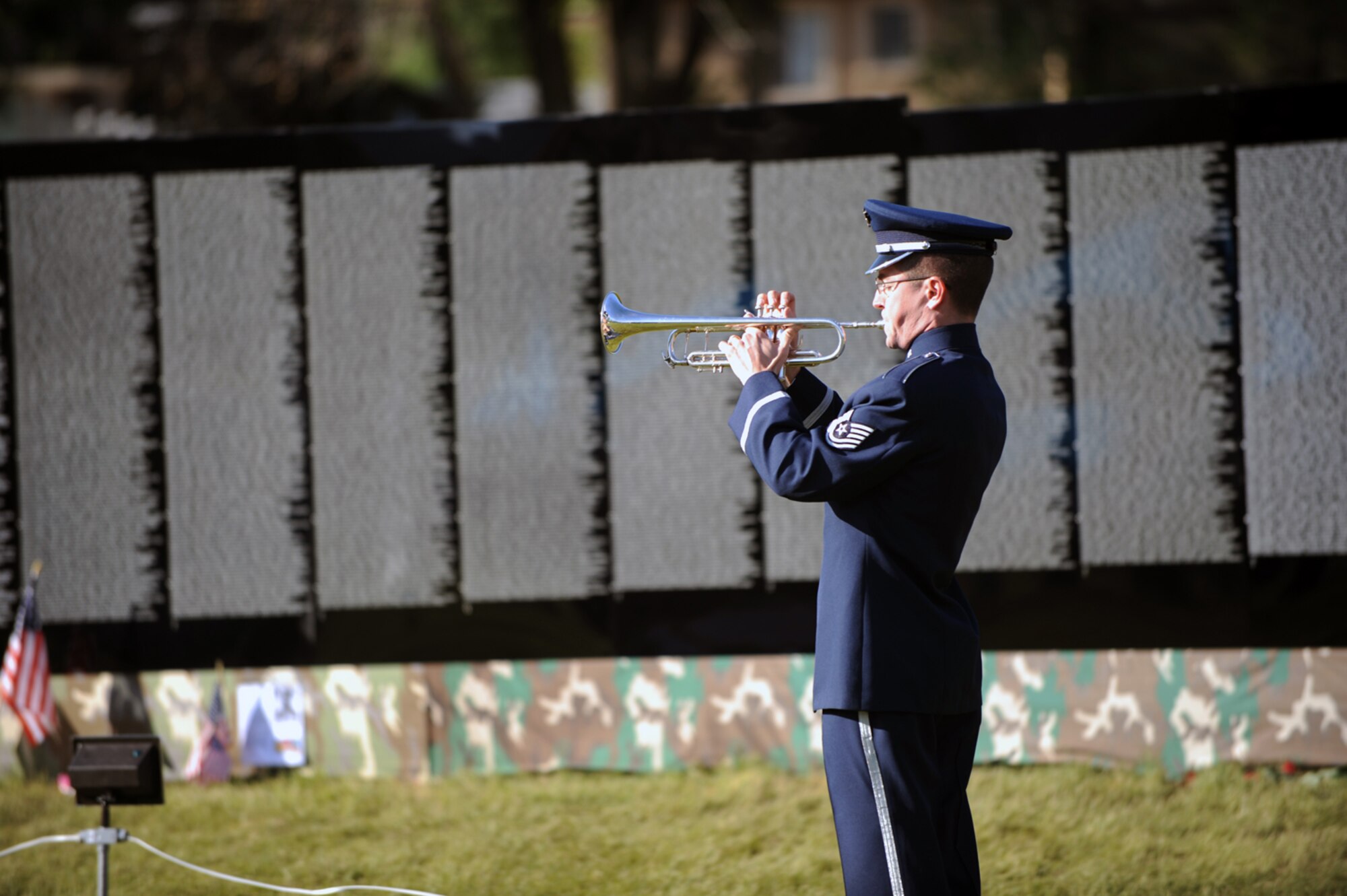 Tech. Sgt. Michael Richter plays Taps during a ceremony in Ogden, Utah, on Memorial Day. Sergeant Richter was featured in a patriotic program in support of the Traveling Vietnam Memorial Wall. (U.S. Air Force photo/Staff Sgt. Kyle Brasier)