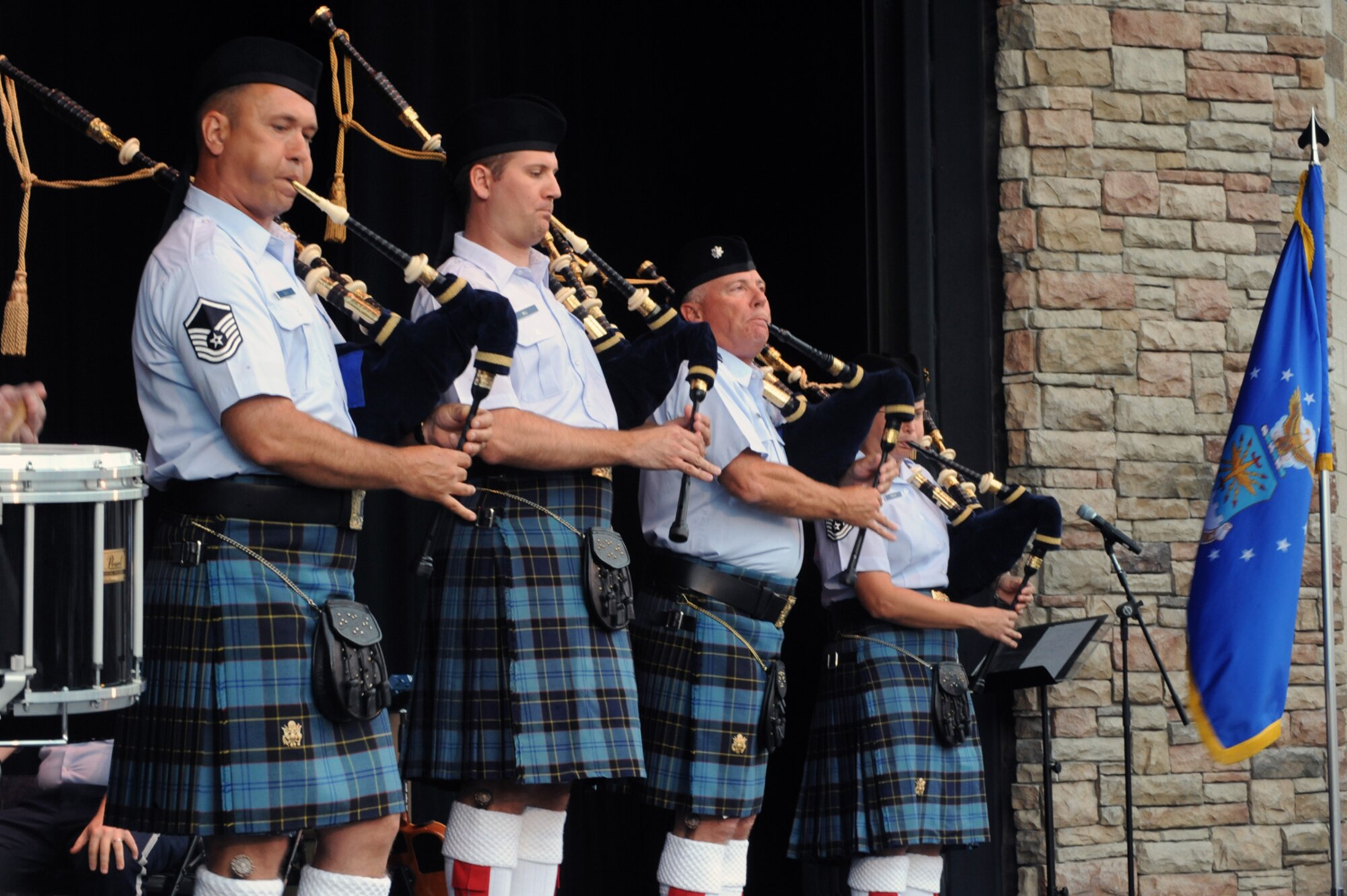 Bagpipers (from left) Master Sgt. Scott Gunn, Tech. Sgt. Benjamin Hill, Lt. Col. Kenneth Baker, Tech. Sgt. Kara Frank, members of the Band of the U.S. Air Force Reserve, were featured performers during a Memorial Day celebration in Ogden, Utah, May 23. The 43-member concert band played several shows across the Wasatch Front to help kick off Air Force Week: Salt Lake City. (U.S. Air Force photo/Staff Sgt. Kyle Brasier)