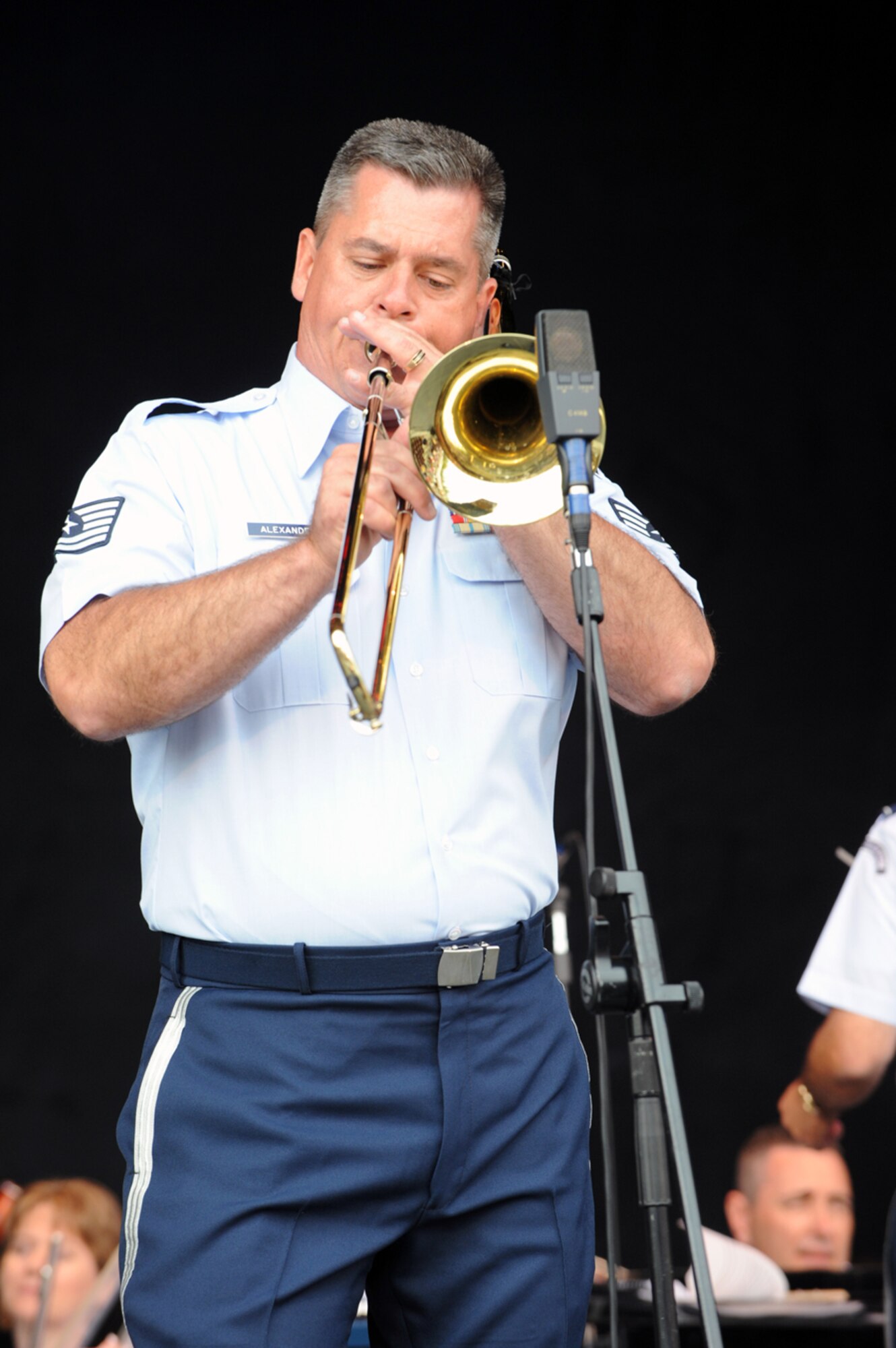 Tech. Sgt. John Alexander, a musician in the Band of the United States Air Force Reserve, performs a trombone solo during a performance in Ogden, Utah, May 23. The 43-member concert band played several shows across the Wasatch Front over the Memorial Day weekend to help kick off Air Force Week: Salt Lake City. (U.S. Air Force photo/Staff Sgt. Kyle Brasier)
