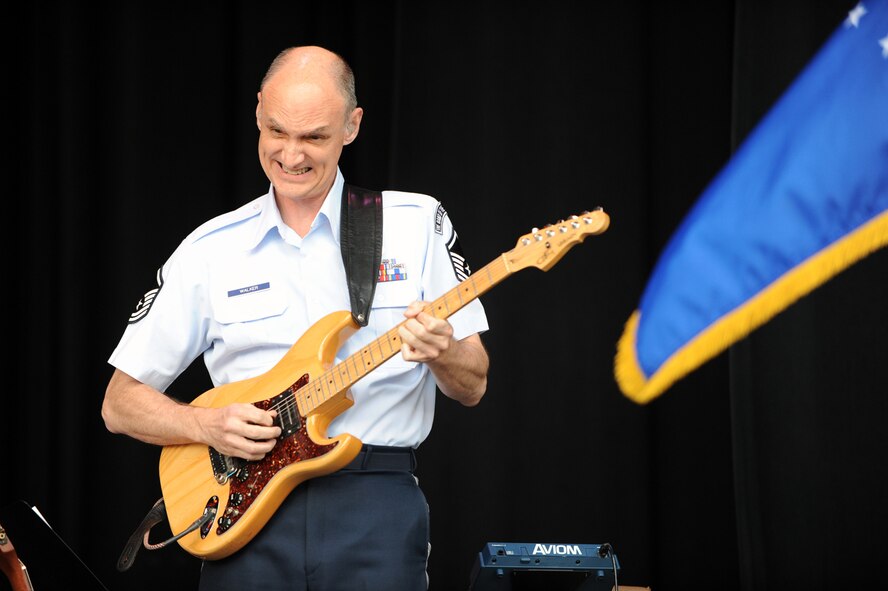 Master Sgt. Rob Walker, member of the Band of the United States Air Force Reserve, busts out a spirited guitar solo during a performance in Ogden, Utah, May 23. The 43-member concert band played several shows across the Wasatch Front over the Memorial Day weekend as a prelude to Air Force Week: Salt Lake City. (U.S. Air Force photo/Staff Sgt. Kyle Brasier)
