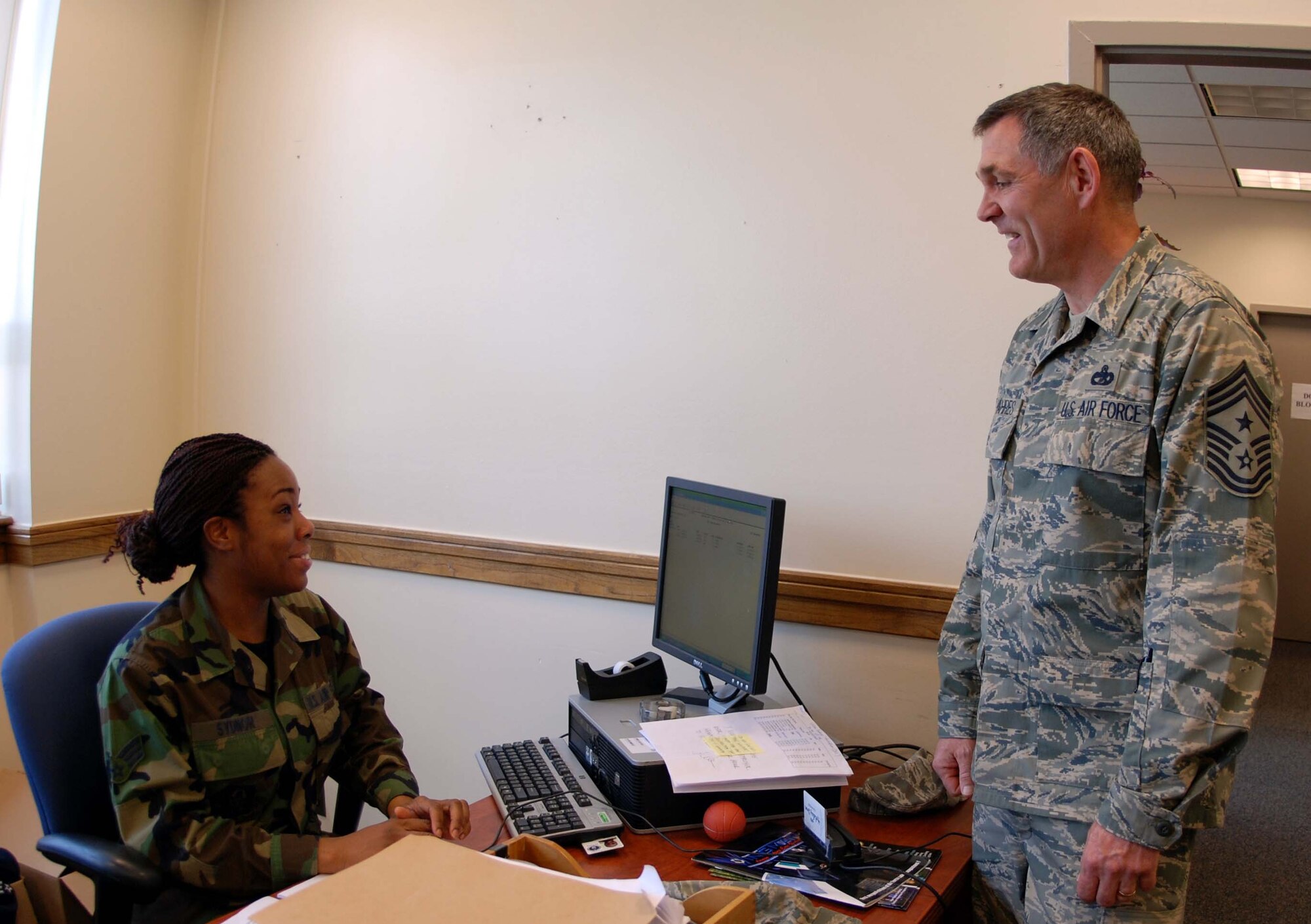 Chief Master Sgt. Clifford Van Yahres, the new command chief of the 459th Air Refueling Wing, talks with Senior Airman Simone Sydnor, 459th Logistics Readiness Flight logistics planner April 5. (U.S. Air Force photo/ Senior Airman Ashley Crawford)
