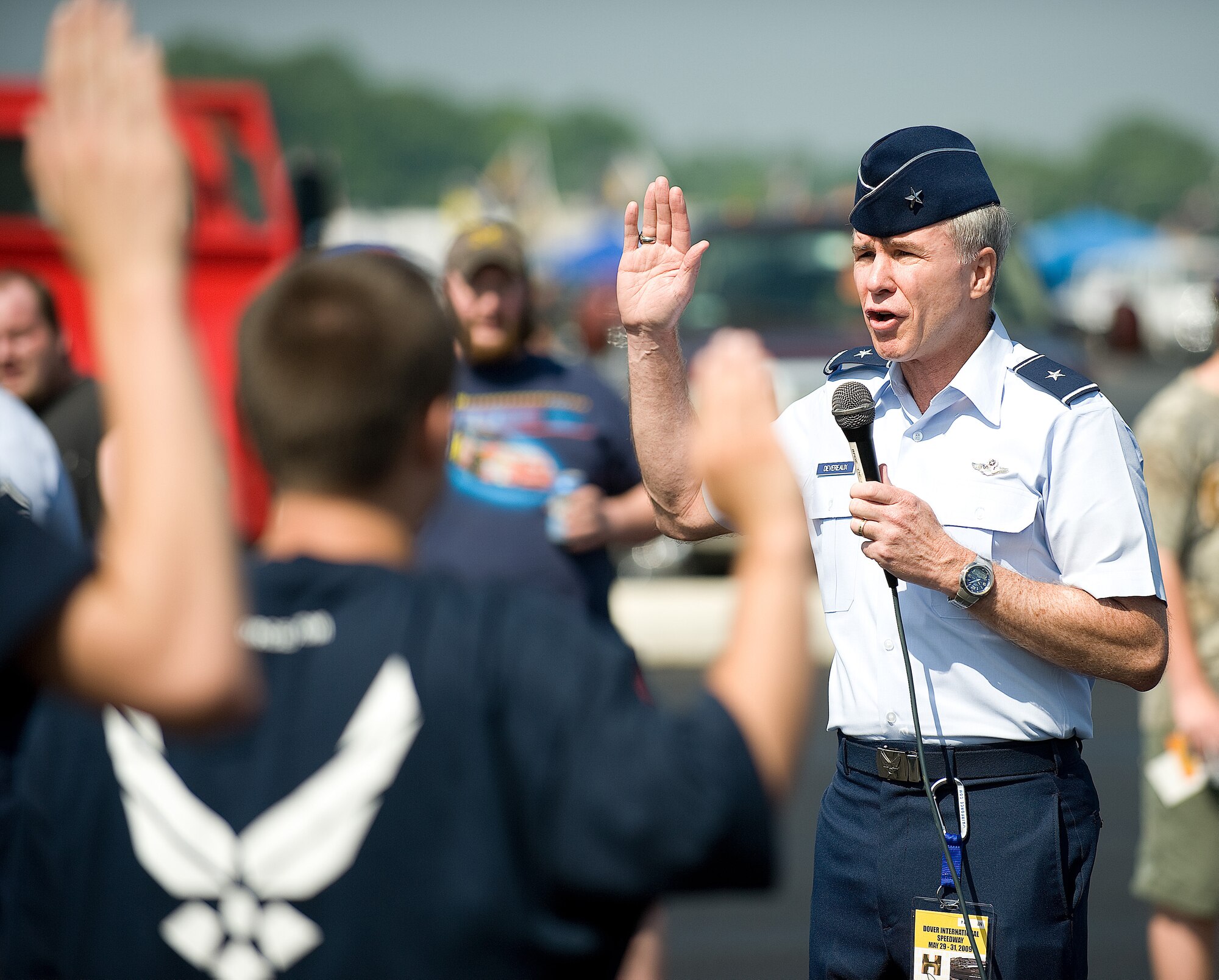 Brig. Gen. Richard Devereaux, director of Intelligence, Operations and Nuclear Integration, Air Education and Training Command; swears in Air Force recruits at Dover Downs May 31.  (U.S. Air Force photo/Jason Minto)