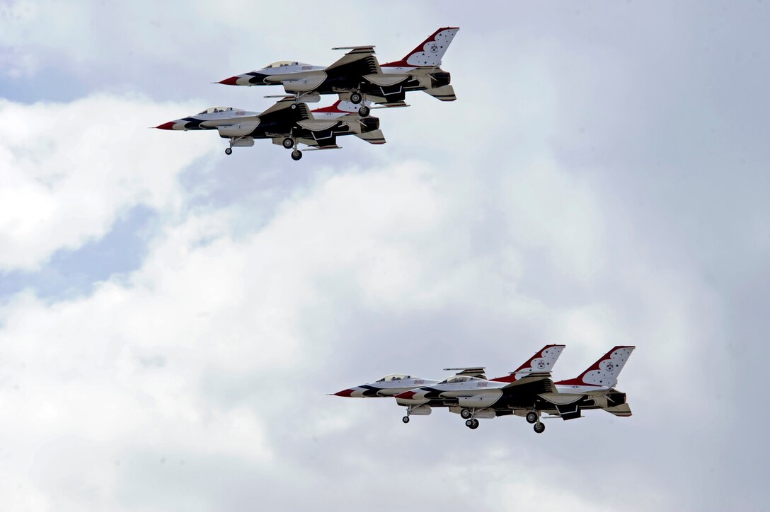The U.S. Air Force Thunderbirds demonstrate an aerial maneuver that highlights their piloting skills and precision during the Dakota Thunder 2009 open house and air show here May 31. The two-day event featured multiple static displays, demonstrations, and aerial performances to attract more than 40,000 visitors to Ellsworth Air Force Base, S.D. (U.S. Air Force photo/Airman 1st Class Matthew Flynn)