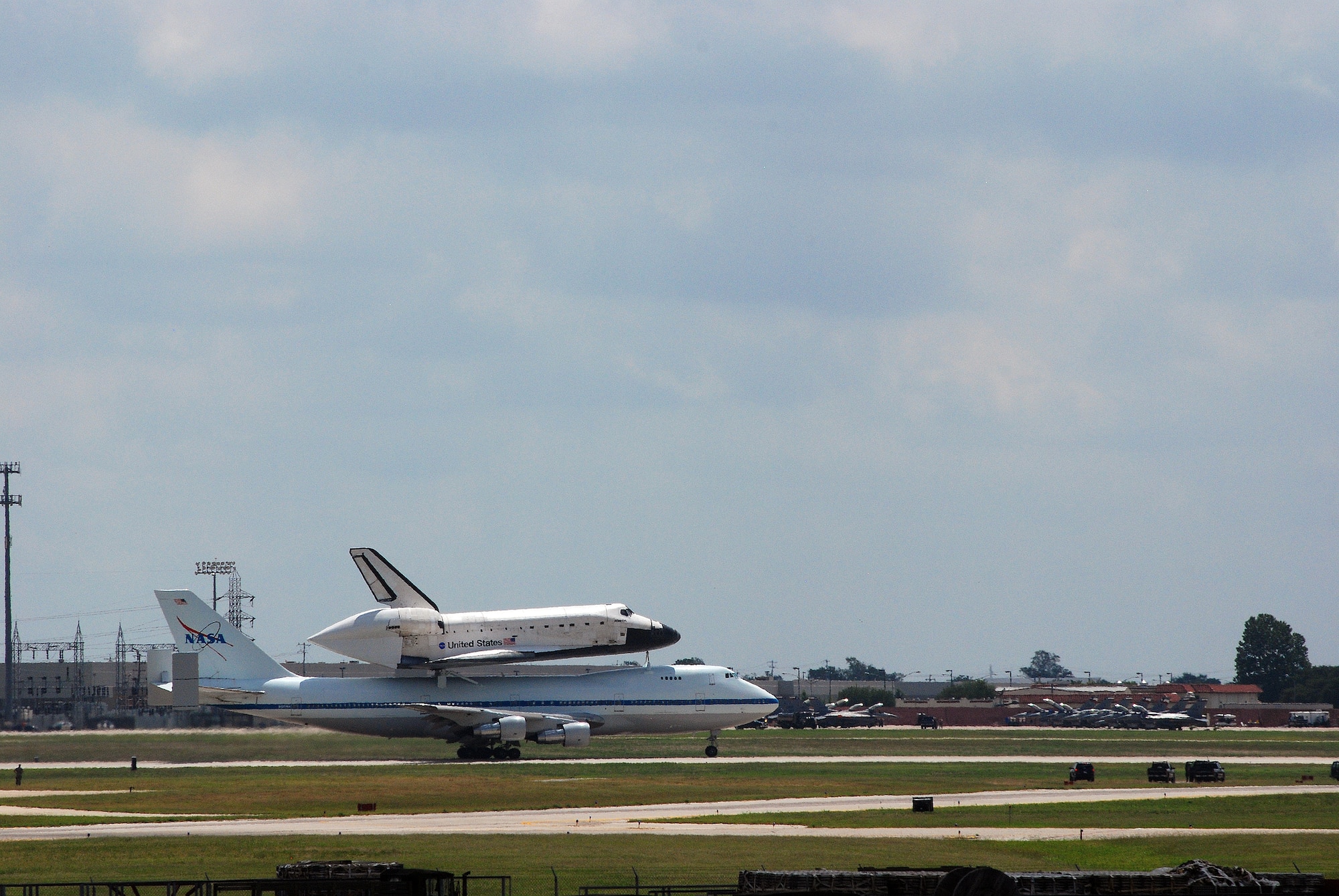 Space Shuttle Atlantis made a pit-stop, to a parking area near the 433rd Airlift Wing at Lackland AFB, Texas, today (June 2, 2009). The shuttle is on its way home to Kennedy Space Center, Fla., from the landing site at Edwards AFB, Calif. According to Ms. Candrea Thomas, public affairs officer at NASA's Kennedy Space Center, Atlantis was returning from "STS Mission 125" where the crew serviced and upgraded the Hubble Space Telescope on the International Space Station. Weather caused a delay and relocation of the landing site. After landing at Edwards AFB, Atlantis was "piggybacked" onto a modified Boeing 747 called a shuttle carrier. The 747 then flew from Edwards to El Paso, Texas and spent the night waiting for severe thunder storms to pass. Next stop was the Lackland AFB flight line. The shuttle carrier took on fuel while parked near the Alamo Wing"s C-5 Galaxy parking ramp. From here, the shuttle plans a stop in Columbus, Ohio and is expected back in Florida early in the evening.  (U.S. Air Force Photo/Airman Brian McGloin)