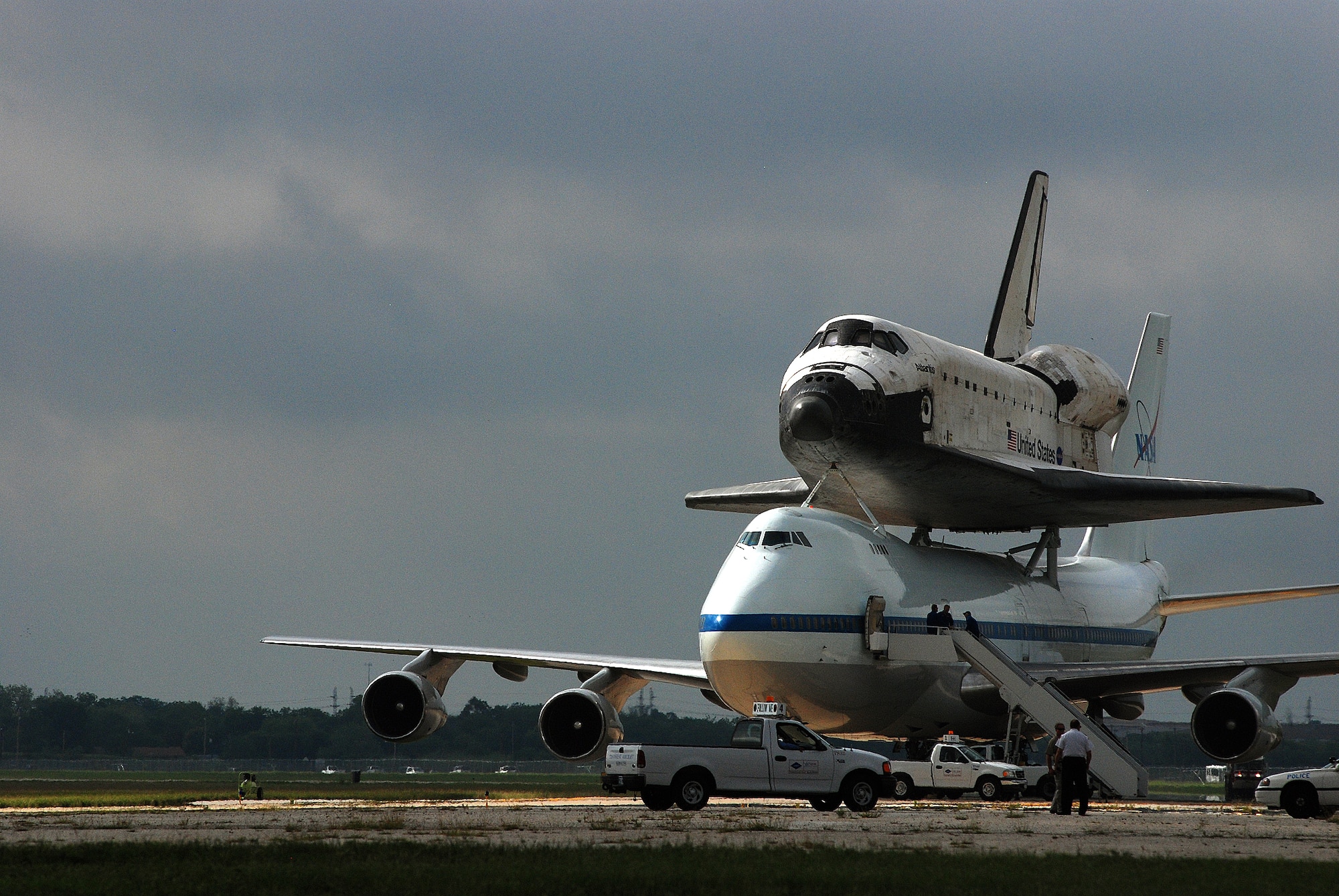 Space Shuttle Atlantis made a pit-stop, to a parking area near the 433rd Airlift Wing at Lackland AFB, Texas, today (June 2, 2009). The shuttle is on its way home to Kennedy Space Center, Fla., from the landing site at Edwards AFB, Calif. According to Ms. Candrea Thomas, public affairs officer at NASA's Kennedy Space Center, Atlantis was returning from "STS Mission 125" where the crew serviced and upgraded the Hubble Space Telescope on the International Space Station. Weather caused a delay and relocation of the landing site. After landing at Edwards AFB, Atlantis was "piggybacked" onto a modified Boeing 747 called a shuttle carrier. The 747 then flew from Edwards to El Paso, Texas and spent the night waiting for severe thunder storms to pass. Next stop was the Lackland AFB flight line. The shuttle carrier took on fuel while parked near the Alamo Wing"s C-5 Galaxy parking ramp. From here, the shuttle plans a stop in Columbus, Ohio and is expected back in Florida early in the evening.  (U.S. Air Force Photo/Airman Brian McGloin)