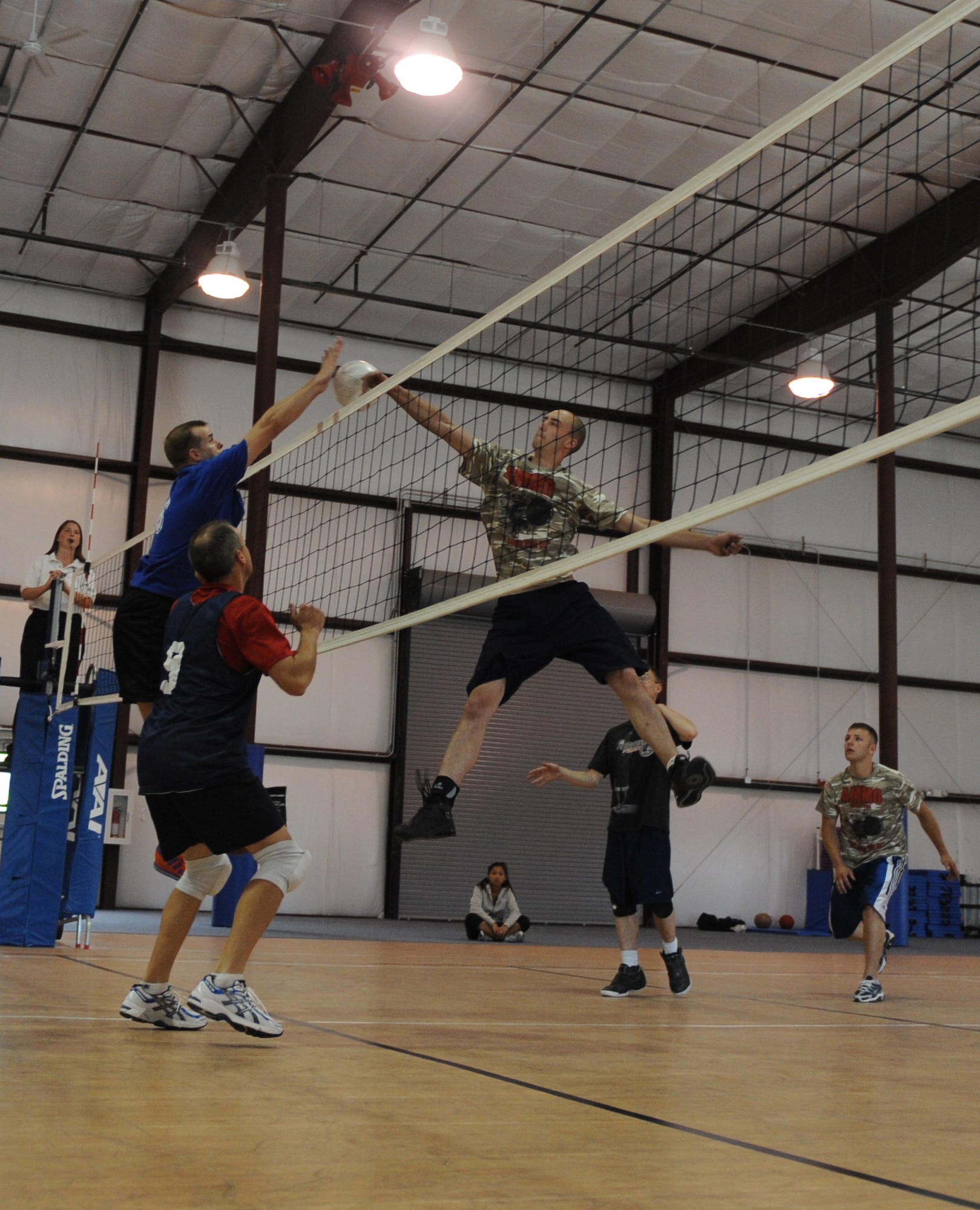 MOUNTAIN HOME AIR FORCE BASE, Idaho – Nicholas Behr (left), 366th Force Support Squadron A-team, goes for a block at the net as Greg Girodo, 366th Equipment Maintenance Squadron ammunitions flight, tries for the spike during the base volleyball championship game May 28. The 366th FSS won two out of three games to claim the championship. (U.S. Air Force photo/ Airman 1st Class Renishia Richardson)