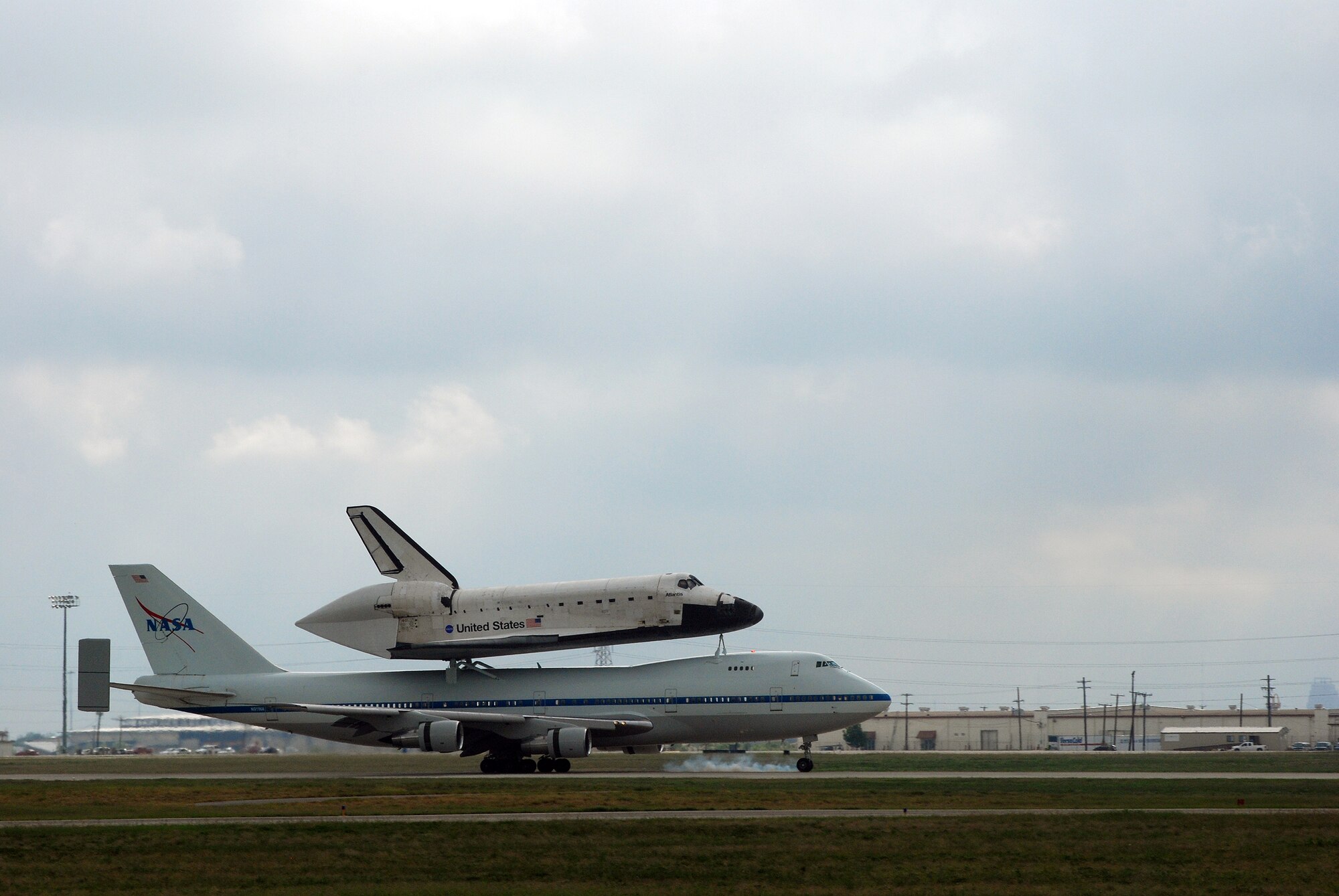 Space Shuttle Atlantis made a pit-stop, to a parking area near the 433rd Airlift Wing at Lackland AFB, Texas, today (June 2, 2009). The shuttle is on its way home to Kennedy Space Center, Fla., from the landing site at Edwards AFB, Calif. According to Ms. Candrea Thomas, public affairs officer at NASA's Kennedy Space Center, Atlantis was returning from "STS Mission 125" where the crew serviced and upgraded the Hubble Space Telescope on the International Space Station. Weather caused a delay and relocation of the landing site. After landing at Edwards AFB, Atlantis was "piggybacked" onto a modified Boeing 747 called a shuttle carrier. The 747 then flew from Edwards to El Paso, Texas and spent the night waiting for severe thunder storms to pass. Next stop was the Lackland AFB flight line. The shuttle carrier took on fuel while parked near the Alamo Wing's C-5 Galaxy parking ramp. From here, the shuttle plans a stop in Columbus, Ohio and is expected back in Florida early in the evening.  (U.S. Air Force Photo/Airman Brian McGloin)