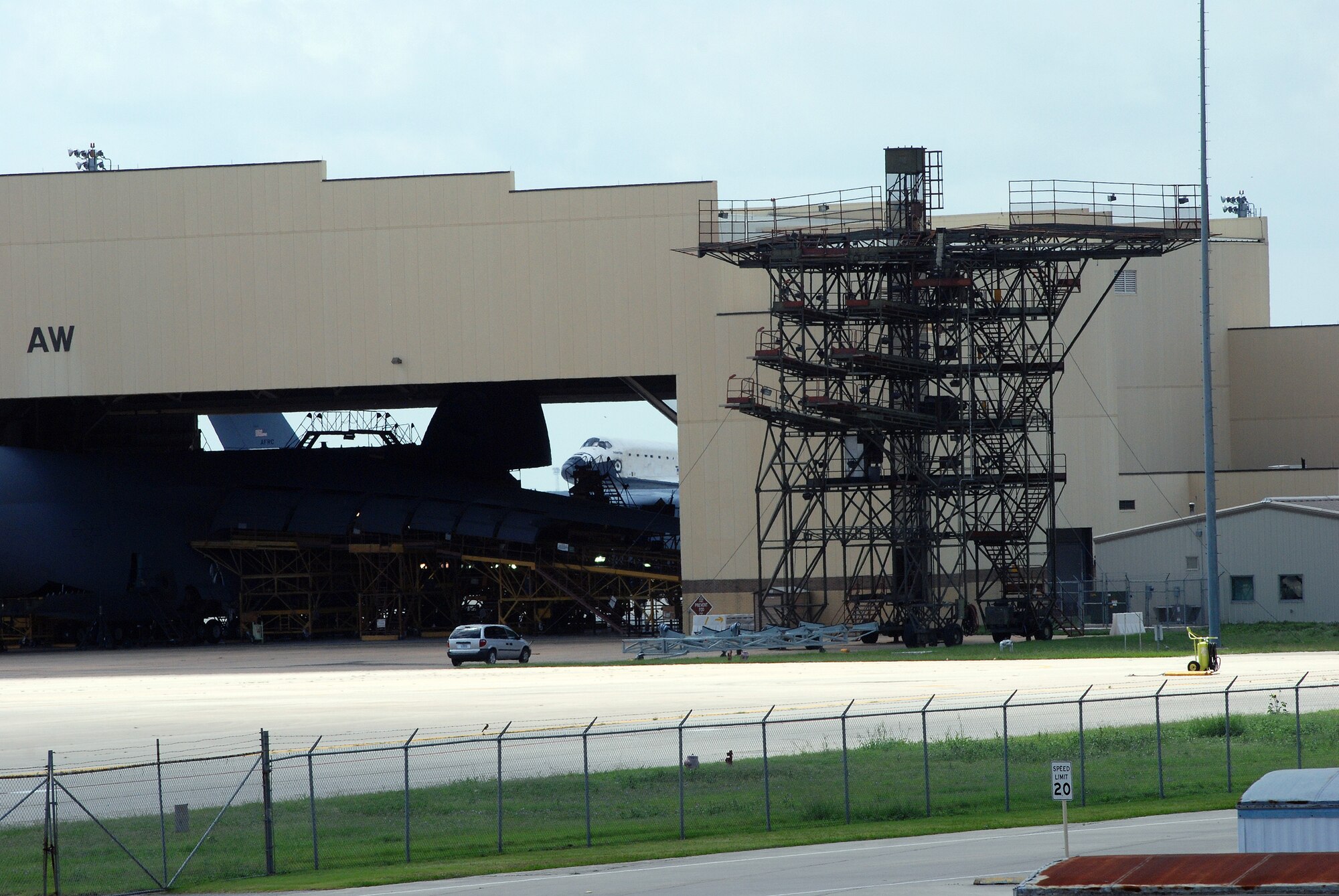 Space Shuttle Atlantis made a pit-stop, to a parking area near the 433rd Airlift Wing at Lackland AFB, Texas, today (June 2, 2009). The shuttle is on its way home to Kennedy Space Center, Fla., from the landing site at Edwards AFB, Calif. According to Ms. Candrea Thomas, public affairs officer at NASA's Kennedy Space Center, Atlantis was returning from "STS Mission 125" where the crew serviced and upgraded the Hubble Space Telescope on the International Space Station. Weather caused a delay and relocation of the landing site. After landing at Edwards AFB, Atlantis was "piggybacked" onto a modified Boeing 747 called a shuttle carrier. The 747 then flew from Edwards to El Paso, Texas and spent the night waiting for severe thunder storms to pass. Next stop was the Lackland AFB flight line. The shuttle carrier took on fuel while parked near the Alamo Wing"s C-5 Galaxy parking ramp. From here, the shuttle plans a stop in Columbus, Ohio and is expected back in Florida early in the evening.  (U.S. Air Force Photo/Airman Brian McGloin)