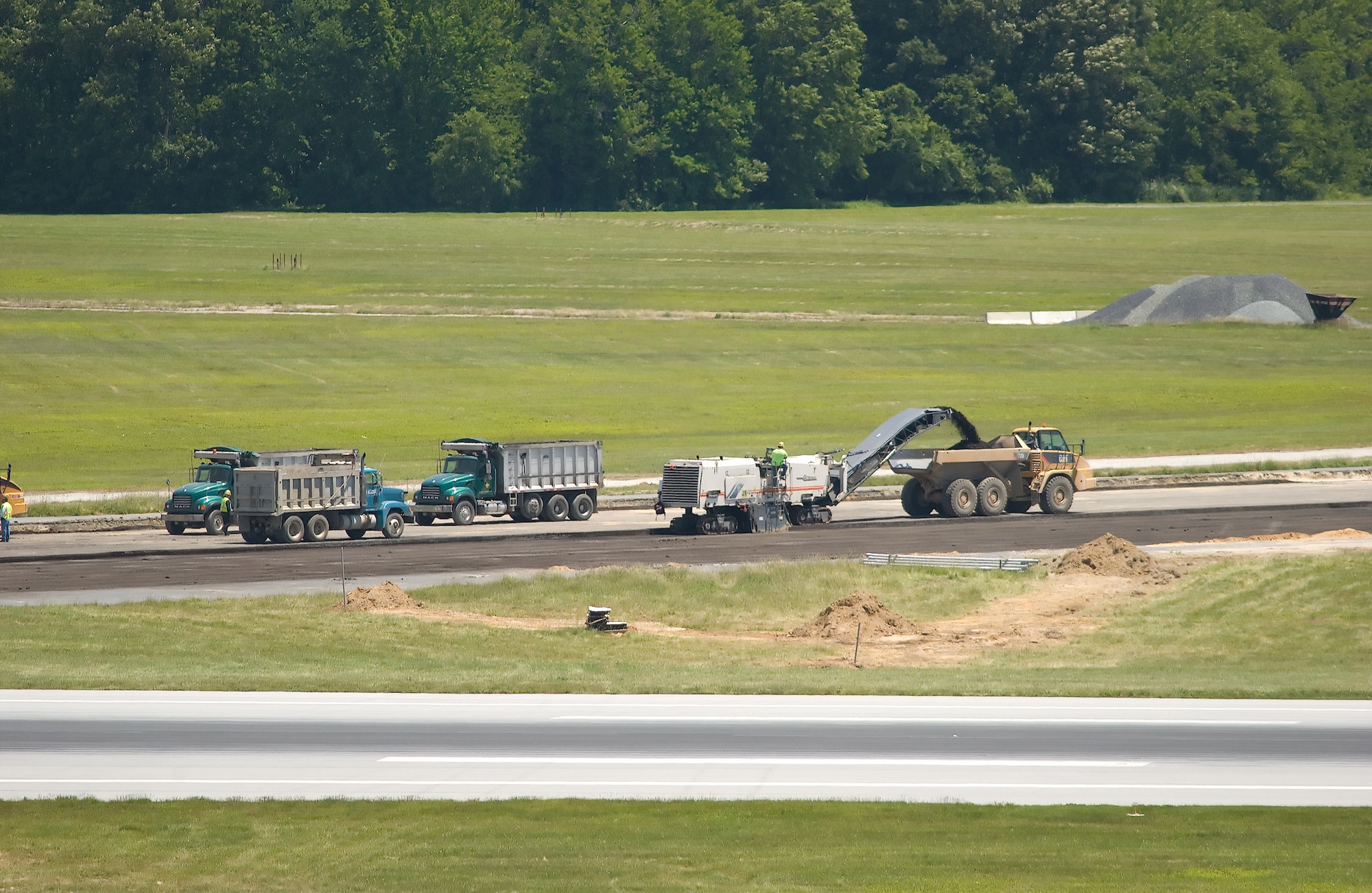 Contractors work on runway 14/32 at Dover Air Force Base. The project involved the demolition of the existing runway and repaving a total distance of 13,800 ft. (U.S. Air Force photo/Jason Minto)
