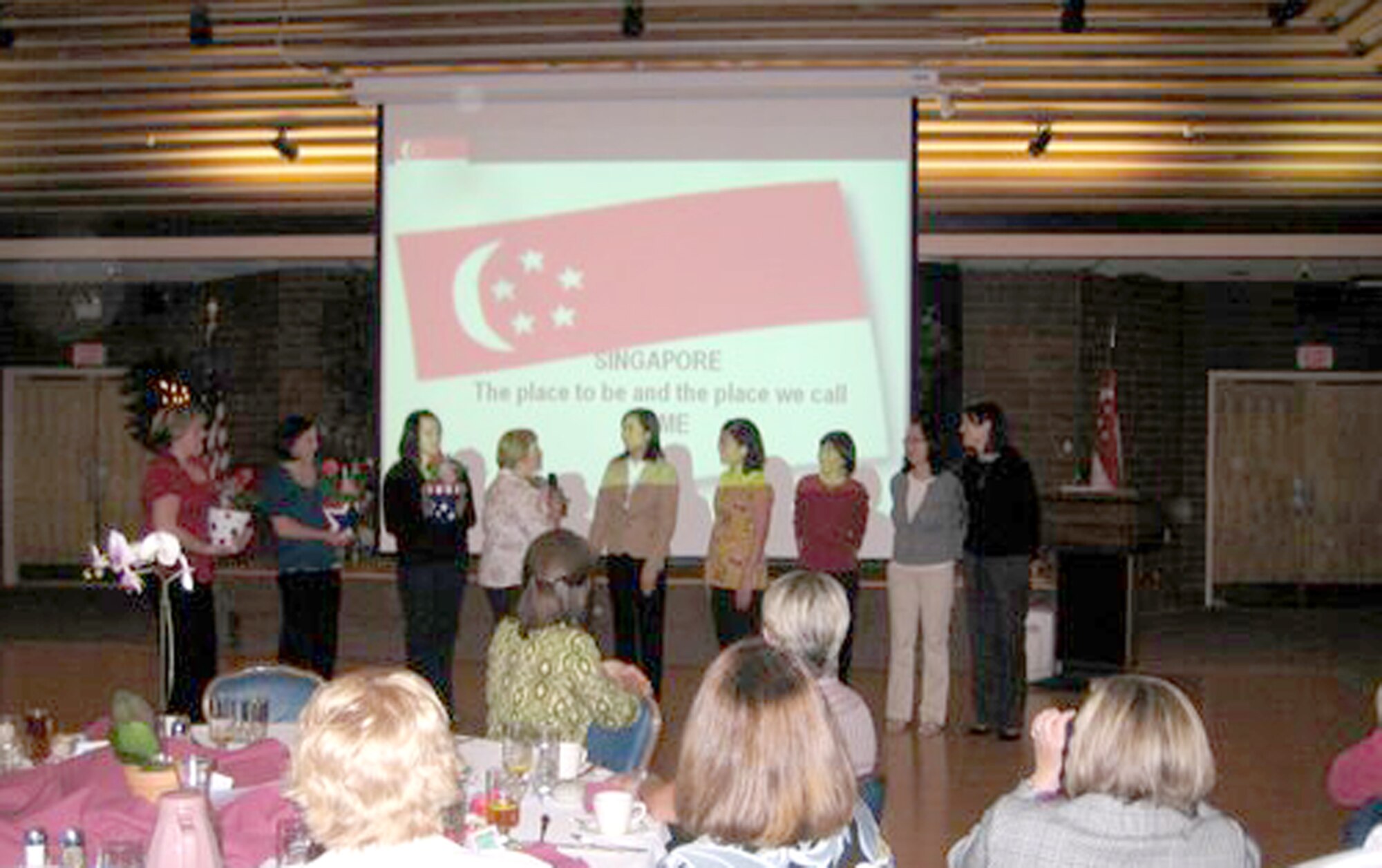 MOUNTAIN HOME AIR FORCE BASE, Idaho - The 366th Maintenance Group spouses hosted the Officer Spouses Club function “Presenting Singapore!” May 12. More than 75 OSC members and Republic of Singapore air force spouses attended the function. Presenting the program, “Singapore, the place to be and the place we call home,” was Valerie Wong, spouse of Lt. Col. Lim Chee Meng. Sheryl West, spouse of Lt. Col. Dane West, said the 366th MXG spouses felt the program promoted appreciation, understanding and further integration of the new RSAF spouses into the Mountain Home community. (Photo courtesy Chandra Depriest)