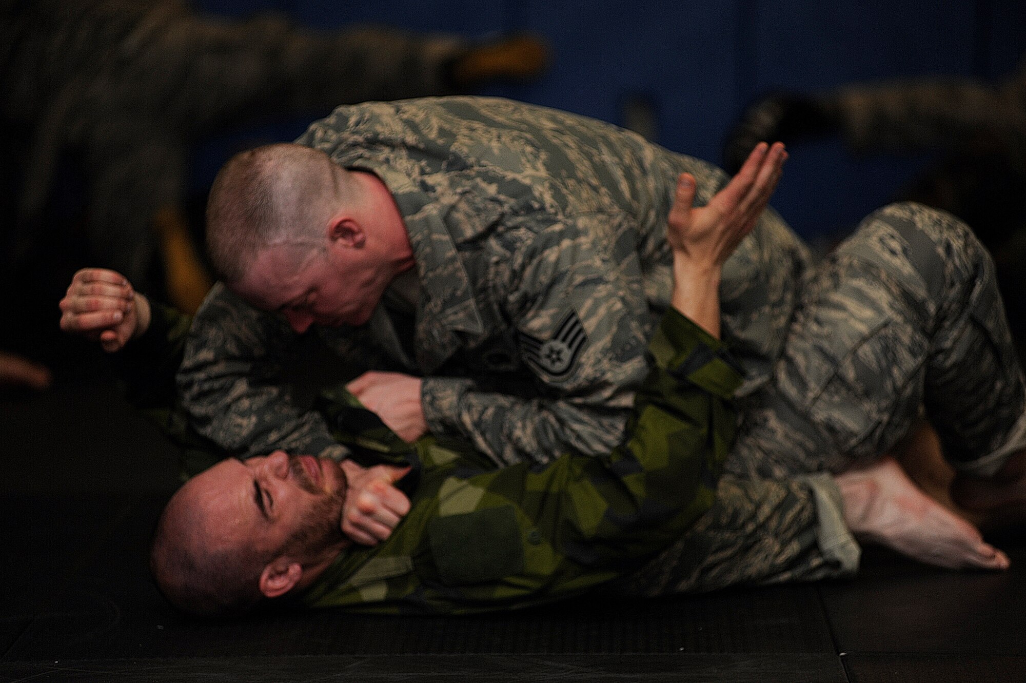 A Swedish Lieutenant taps his partner during Raven Combative maneuvers April 12  during a Pheonix Raven Training Course taught by the U.S. Air Force Expeditionary Center's 421st Combat Training Squadron on Fort Dix.  (U.S. Air Force Photo/Staff Sgt. Nathan G. Bevier) 