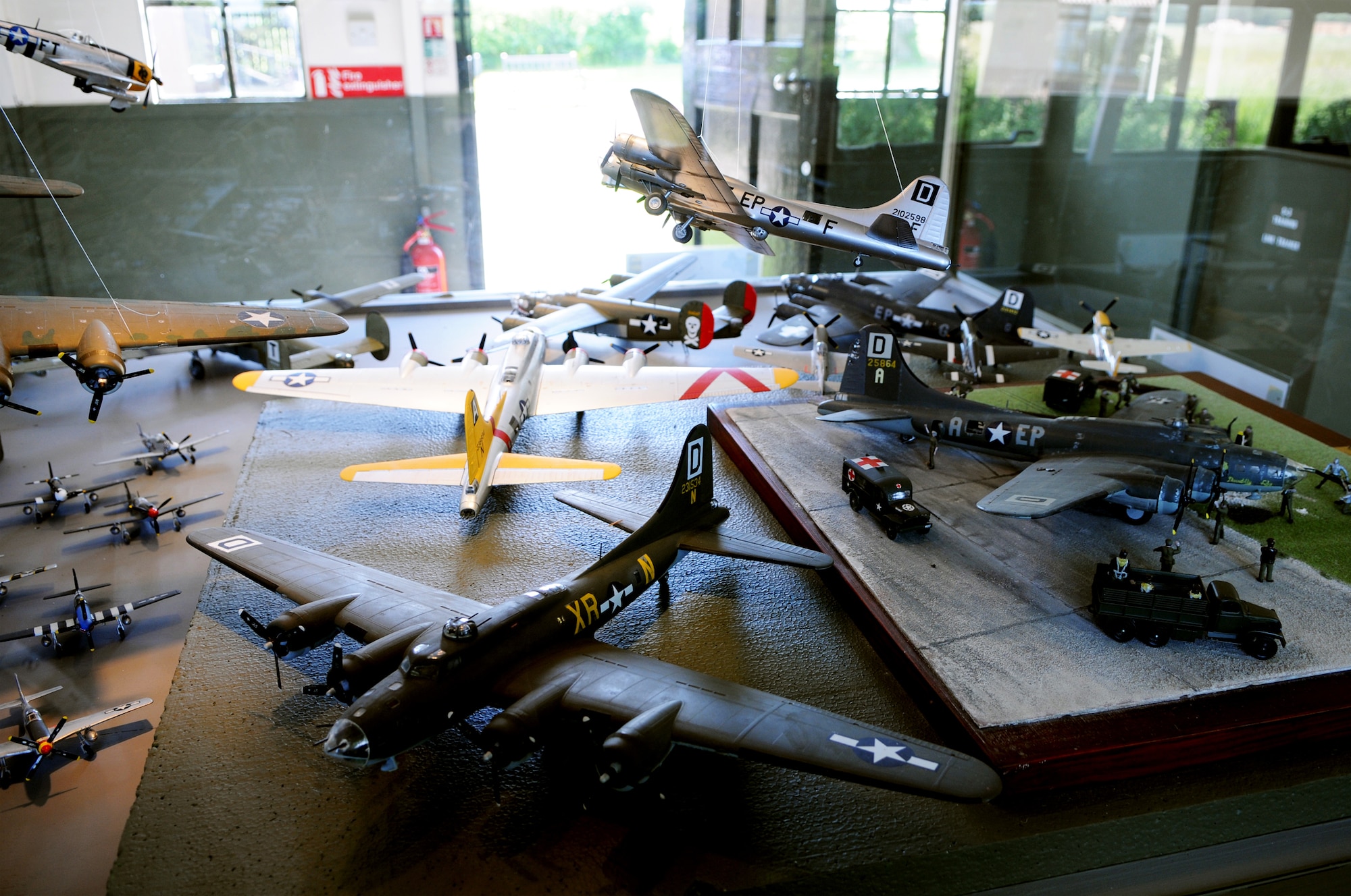 A display of model aircraft, many of which display the same "Box D" insignia on the tail of Royal Air Force Mildenhall, England, KC-135 Stratofortresses, sits in one of several buildings June 1 at Thorpe Abbots, England. The airfield was the original home of the 100th Bomb Group in World War II. The airfield and its buildings have been transformed into a museum dedicated to World War II aviation. (U.S. Air Force photo/Staff Sgt. Austin M. May) 
