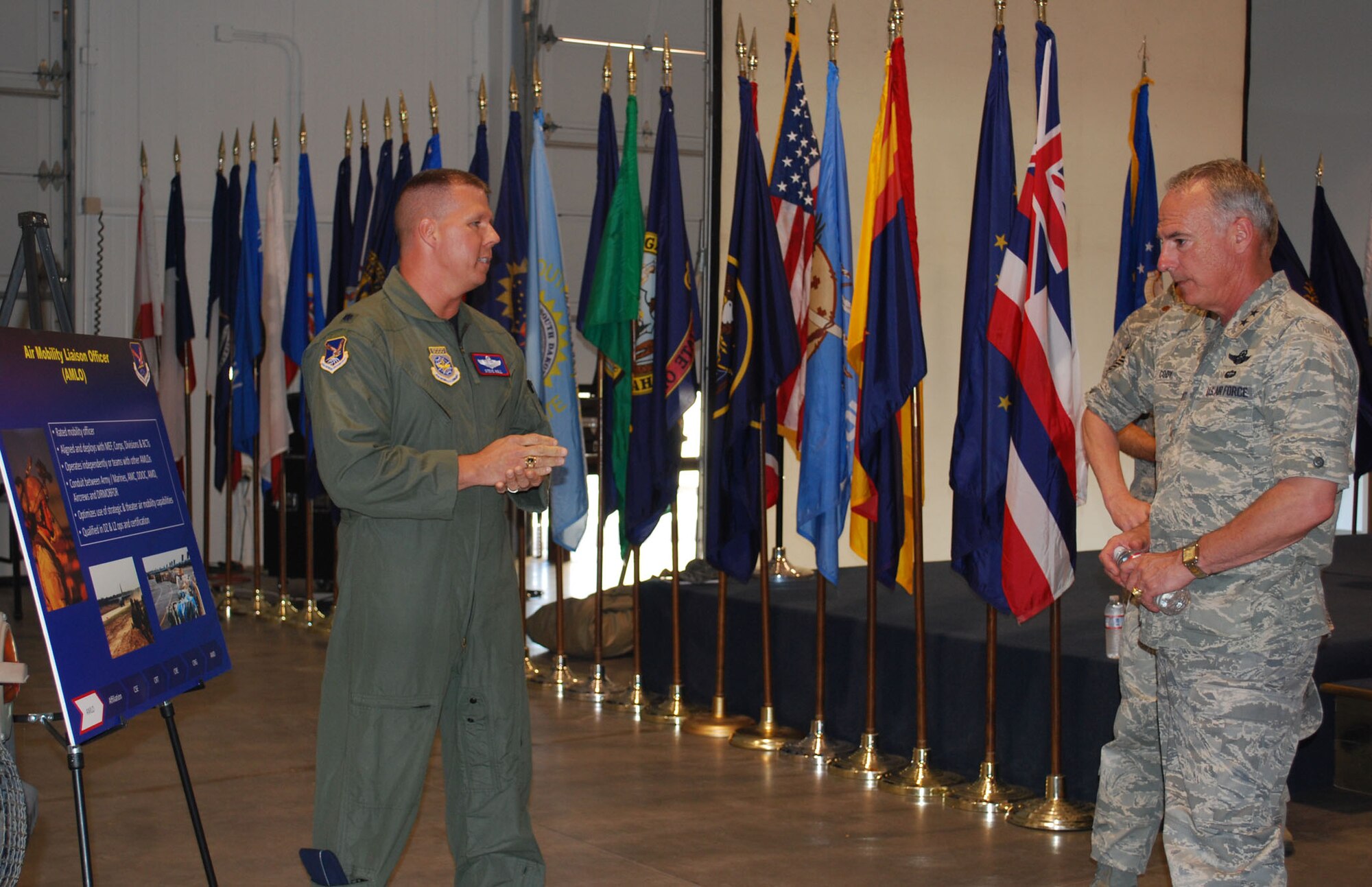 Lt. Col. Steve Noll, Air Mobility Liaison Officer assigned to the 615th Contingency Operations Support Group and stationed at Fort Lewis, Wash., explains the unique mission of AMLOs and how they are the face of Air Mobility Command to the U.S. Army and Marine Corps to Maj. Gen. Winfield Scott III, 18th Air Force commander, during his visit to the 615th Contingency Response Wing May 26.  During his visit, General Scott got an in-depth look at the wing’s myriad capabilities through one-on-one briefings with some of the organization’s elite warrior Airmen and answered questions during an Airmen’s Call May 27.  (U.S. Air Force photo/1st Lt. Nicole Langley)