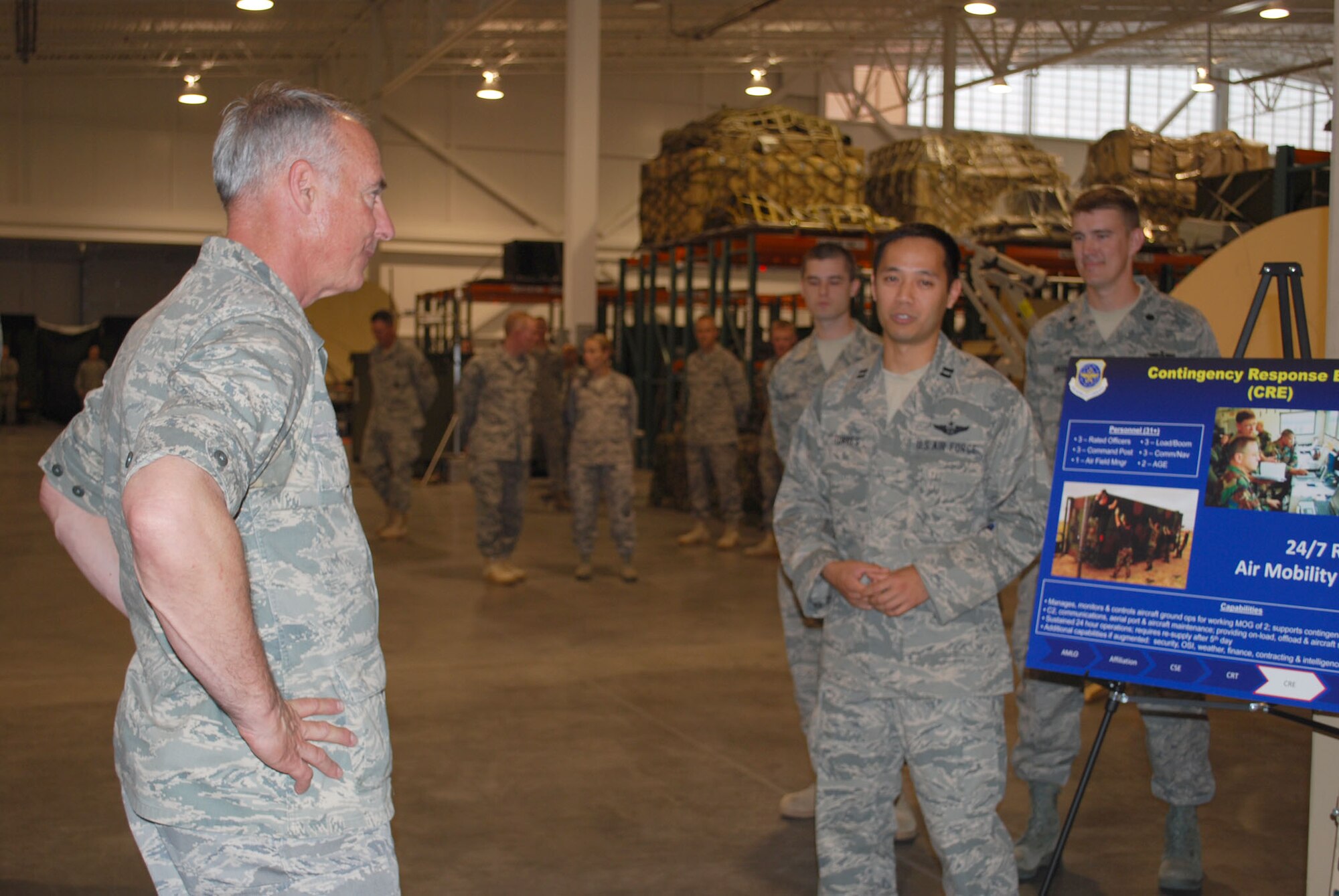Capt. Nick Torres, 573rd Global Support Squadron, explains the aspects of a Contingency Response Element to Maj. Gen. Winfield Scott III, 18th Air Force commander, during his visit to the 615th Contingency Response Wing May 26.  During his visit, General Scott received an in-depth look at the wing’s myriad capabilities through one-on-one briefings with some of the organization’s elite warrior Airmen and answered questions during an Airmen’s Call May 27.  (U.S. Air Force photo/1st Lt. Nicole Langley)