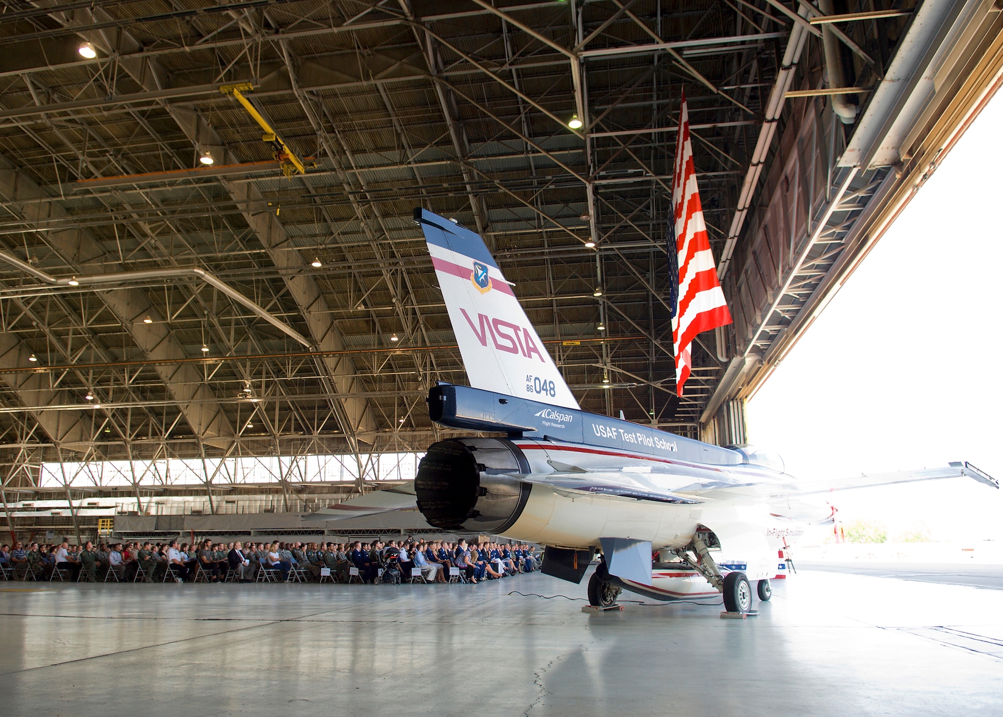 Team Edwards gathers at hangar 1207 during a memorial service for Maj. Mark Graziano May 28. Major Graziano, U.S. Air Force Test Pilot School Class 09-A student, died May 21 when his T-38 Talon crashed nine miles north of Edwards in the Mojave Desert during a student-test mission. (U.S. Air Force photo/Mike Cassidy)
