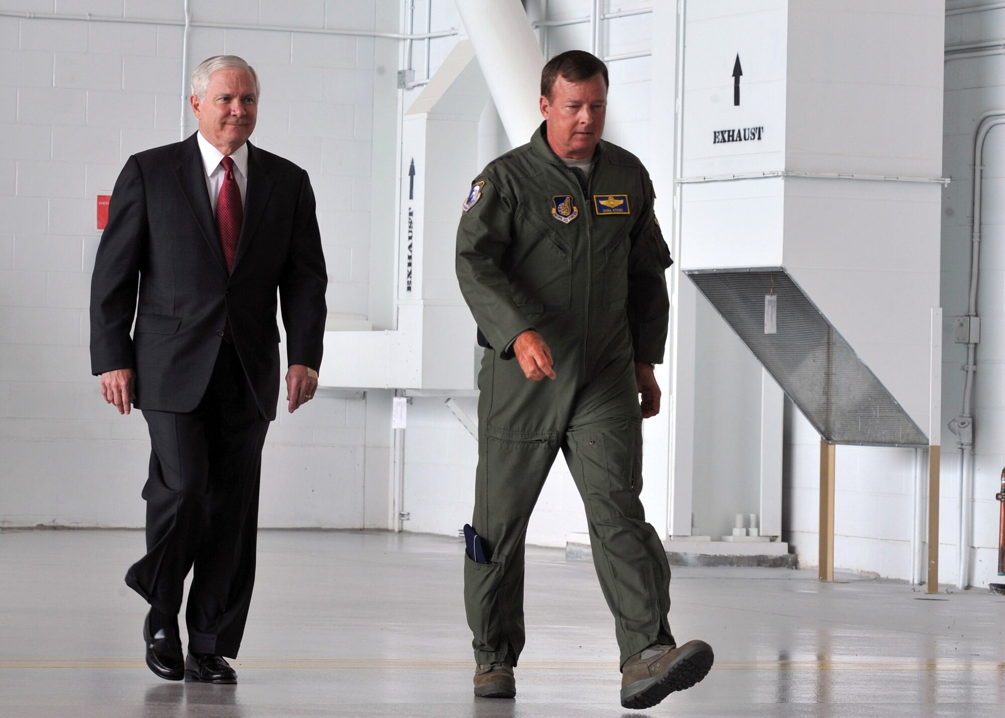 ELMENDORF AIR FORCE BASE, Alaska -- Secretary of Defense Robert M. Gates and Lt. Gen. Dana T. Atkins, Alaskan Command and 11th Air Force Commander, walk to the platform where members of Elmendorf wait to hear Secretary Gates speak June 1, 2009. Secretary Gates visited Elmendorf to discuss how the war is affecting this base and servicemembers' every day lives. (U.S. Air Force/Senior Airman Laura Turner)