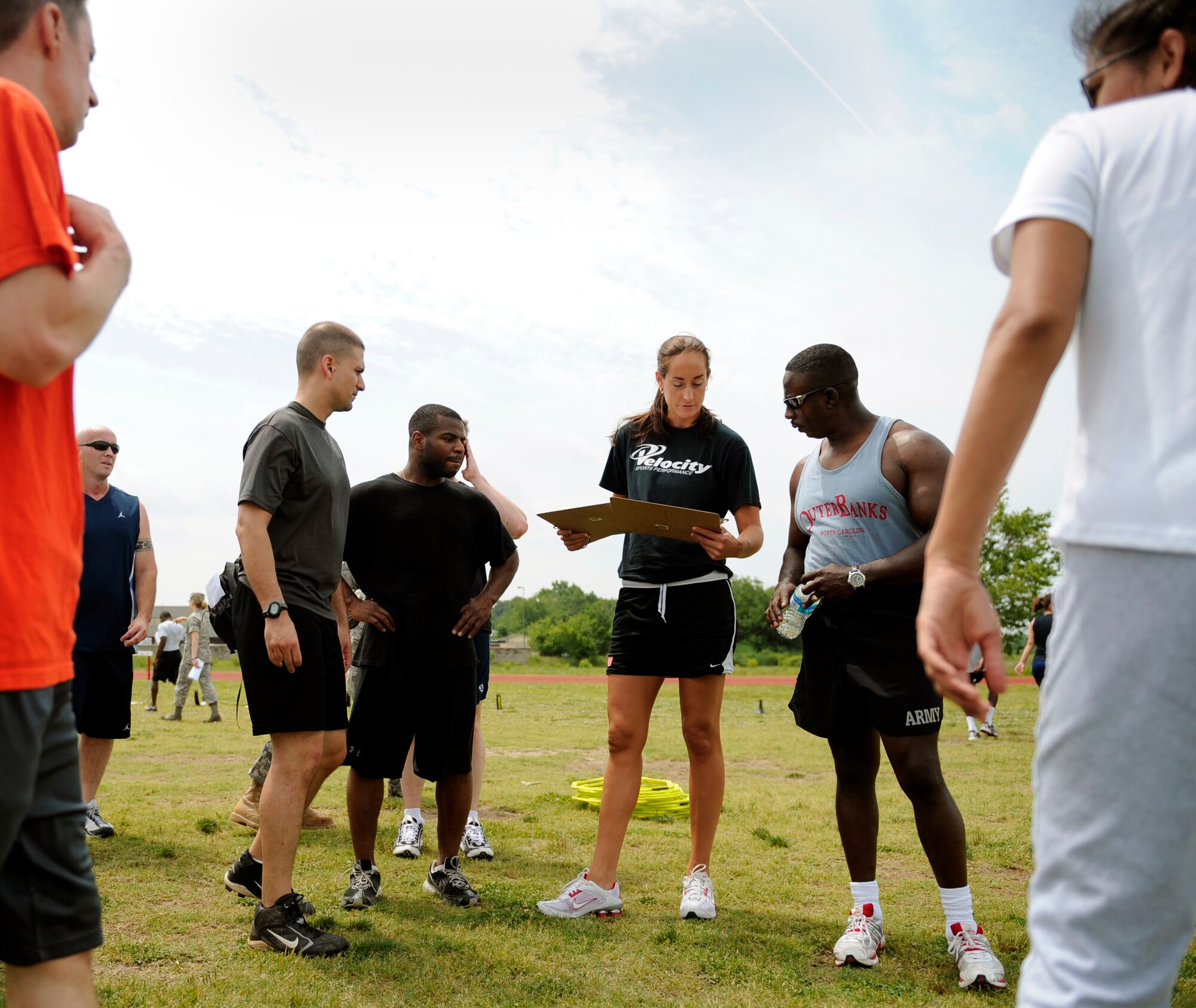 LANGLEY AIR FORCE BASE, Va. -- Ms. Katie Benick, Velocity Center director and manager, explains the purpose of specific exercises with participants during a Velocity class here May 29.  Certified representatives from Velocity led a physical conditioning class geared toward improving overall physical performance in support of May fitness month.  (U.S. Air Force photo/Senior Airman Vernon Young)