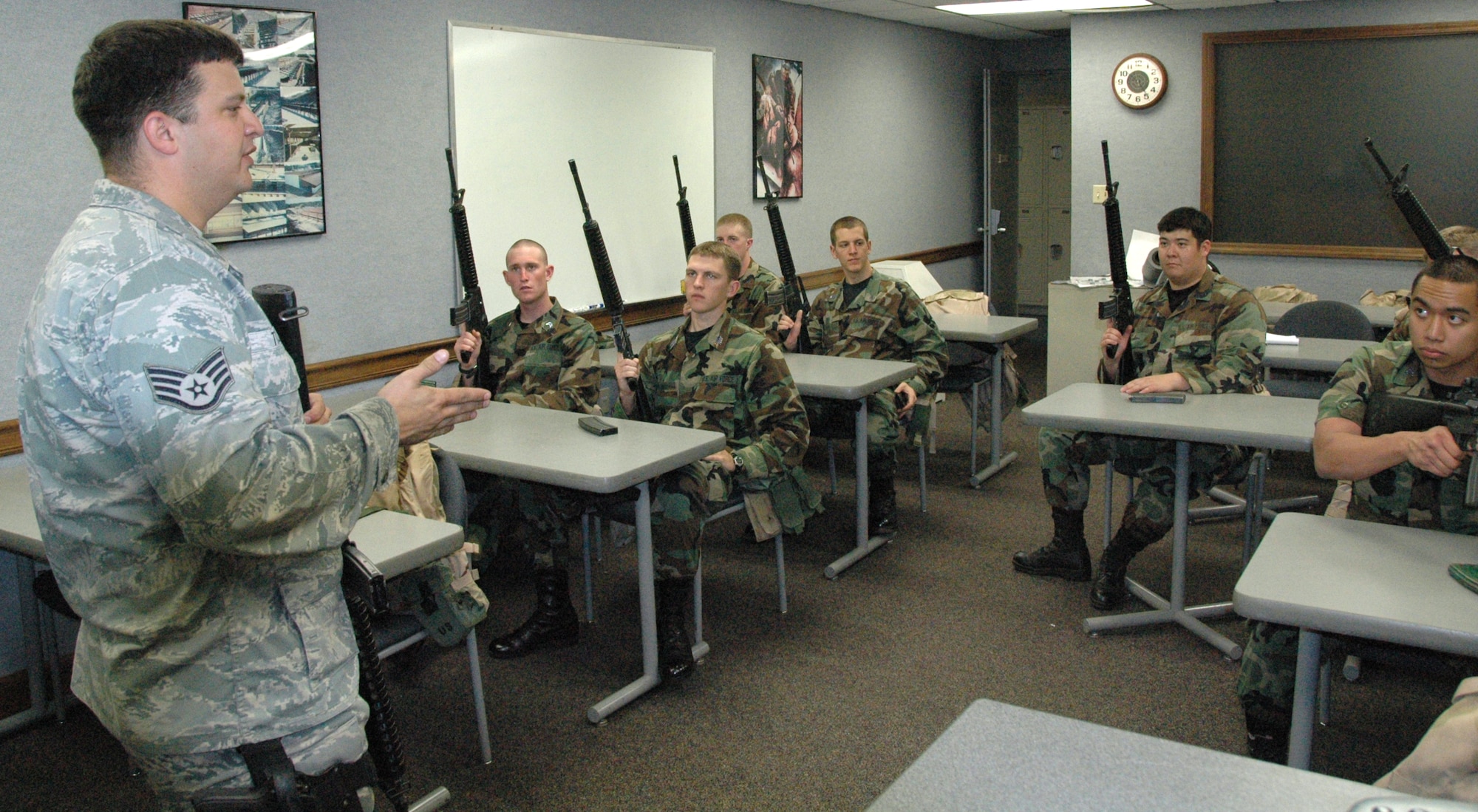 Air Force Academy cadets train in the 325th Security Forces Squadron’s Combat Arms Training and Maintenance classroom, as they listen to Staff Sgt. Jody Tidwell, CATM instructor, prior to shooting M-16s as part of Operation Air Force. The Operation Air Force program is a three-week program designed to give cadets the opportunity to experience firsthand everything an operational Air Force base has to offer.  (U.S. Air Force photo/1st Lt. Cody Chiles)