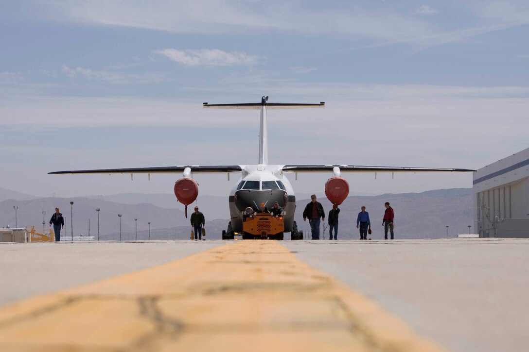 The Advanced Composite Cargo Aircraft is rolled out in May 2009 at Lockheed Martin's Skunk Works, U.S. Air Force Plant 42 in Palmdale, Calif. The ACCA is a modified Dornier 328J aircraft.  The fuselage aft of the crew station and the vertical tail were removed and replaced with completely new structural designs made of advanced composite materials fabricated using out-of-autoclave curing.  Air Force Research Laboratory at Wright-Patterson Air Force Base, Ohio oversees the ACCA program. (Lockheed Martin photo)