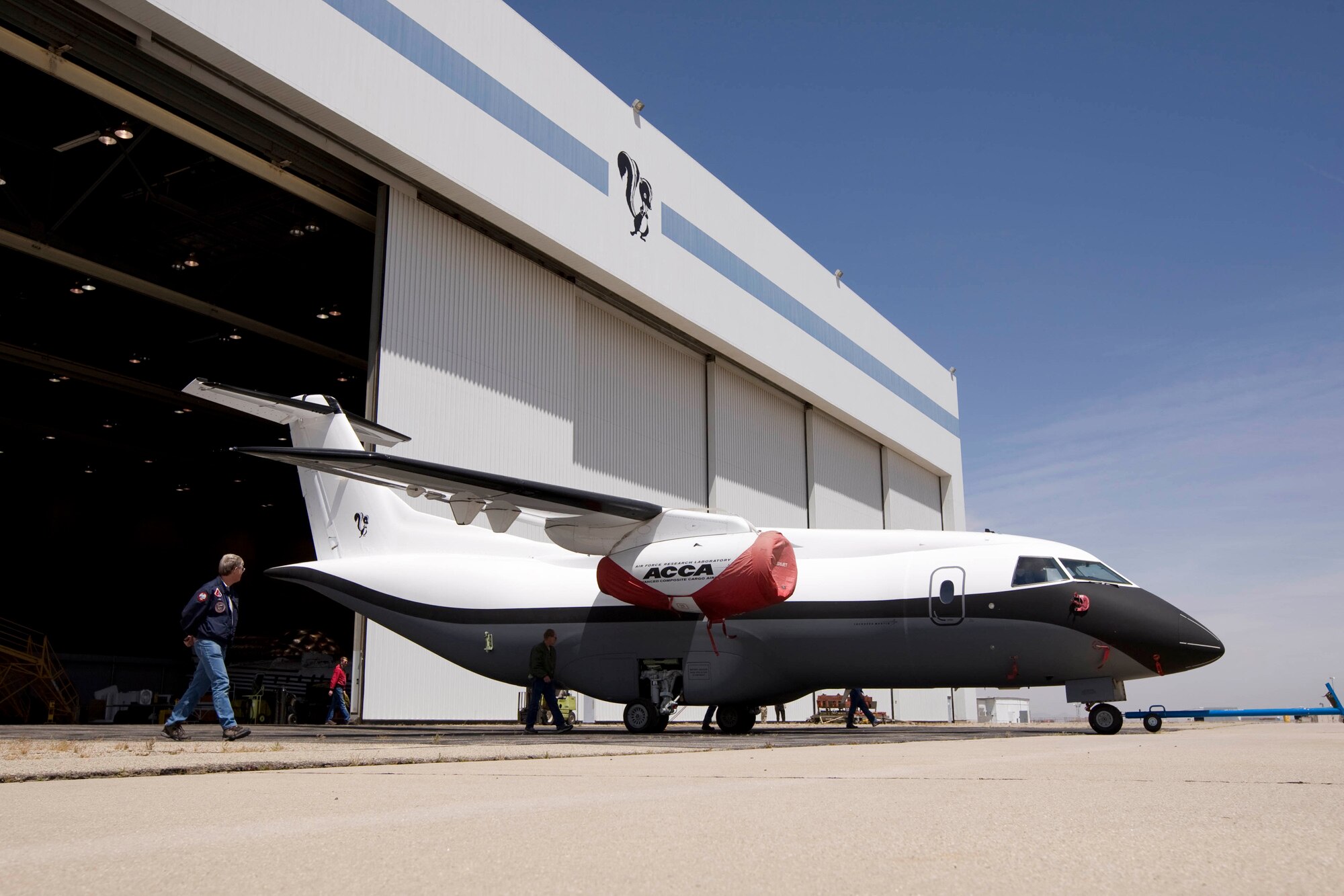 The Advanced Composite Cargo Aircraft is rolled out of a hangar in May 2009 at Lockheed Martin's Skunk Works, U.S. Air Force Plant 42 in Palmdale, Calif. The ACCA is a modified Dornier 328J aircraft.  The fuselage aft of the crew station and the vertical tail were removed and replaced with completely new structural designs made of advanced composite materials fabricated using out-of-autoclave curing.  Air Force Research Laboratory at Wright-Patterson Air Force Base, Ohio oversees the ACCA program. (Lockheed Martin photo)