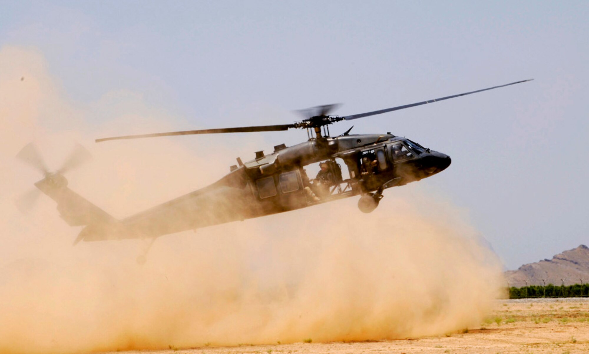 An Army UH-60 Black Hawk comes in to drop off members of 755th Explosive Ordnance Disposal team and members of the 82nd Airborne Division during a joint training operation in support of Operation Enduring Freedom May 5 at Kandahar Airfield, Afghanistan. (U.S. Air Force photo/Staff Sgt. James L. Harper Jr.) 

