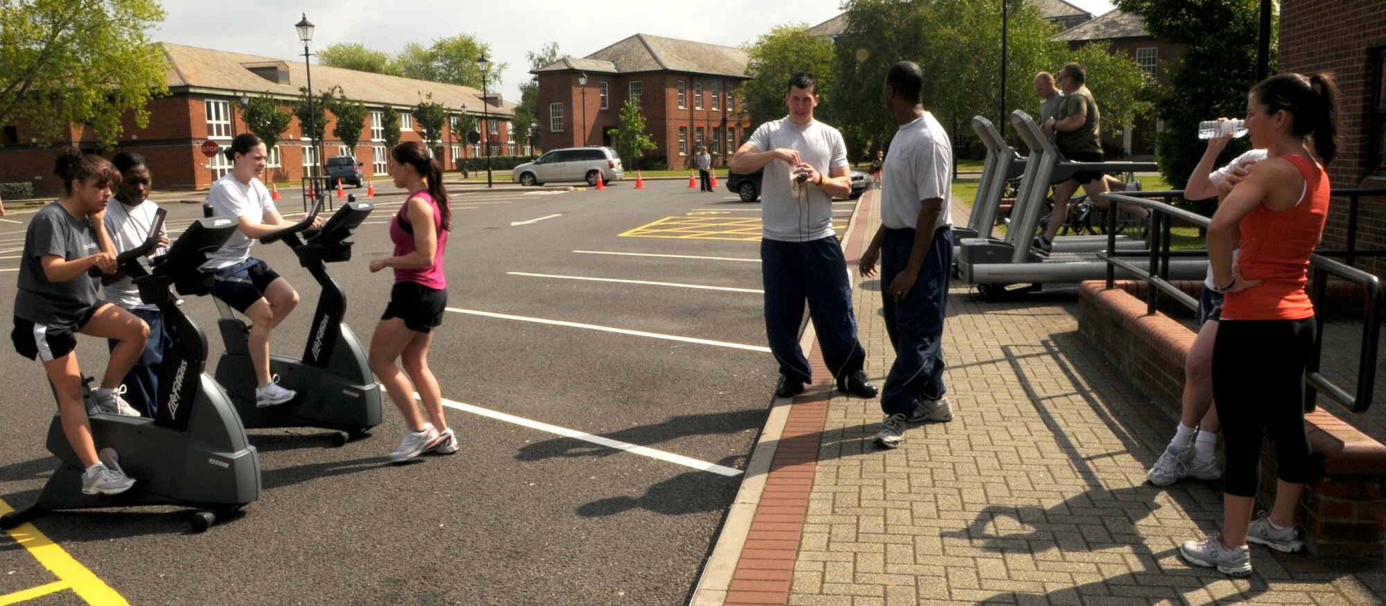 Members of Team Mildenhall gather in front of the north side gym to participate in a fitness expo May 29, 2008.  The event included several contests including tire flipping, Humvee pushing, and the Box D challenge which includes a series of cardio and callisthenic exercises scored on the best time.  (U.S. Air Force photo by Staff Sgt. Christopher L. Ingersoll)