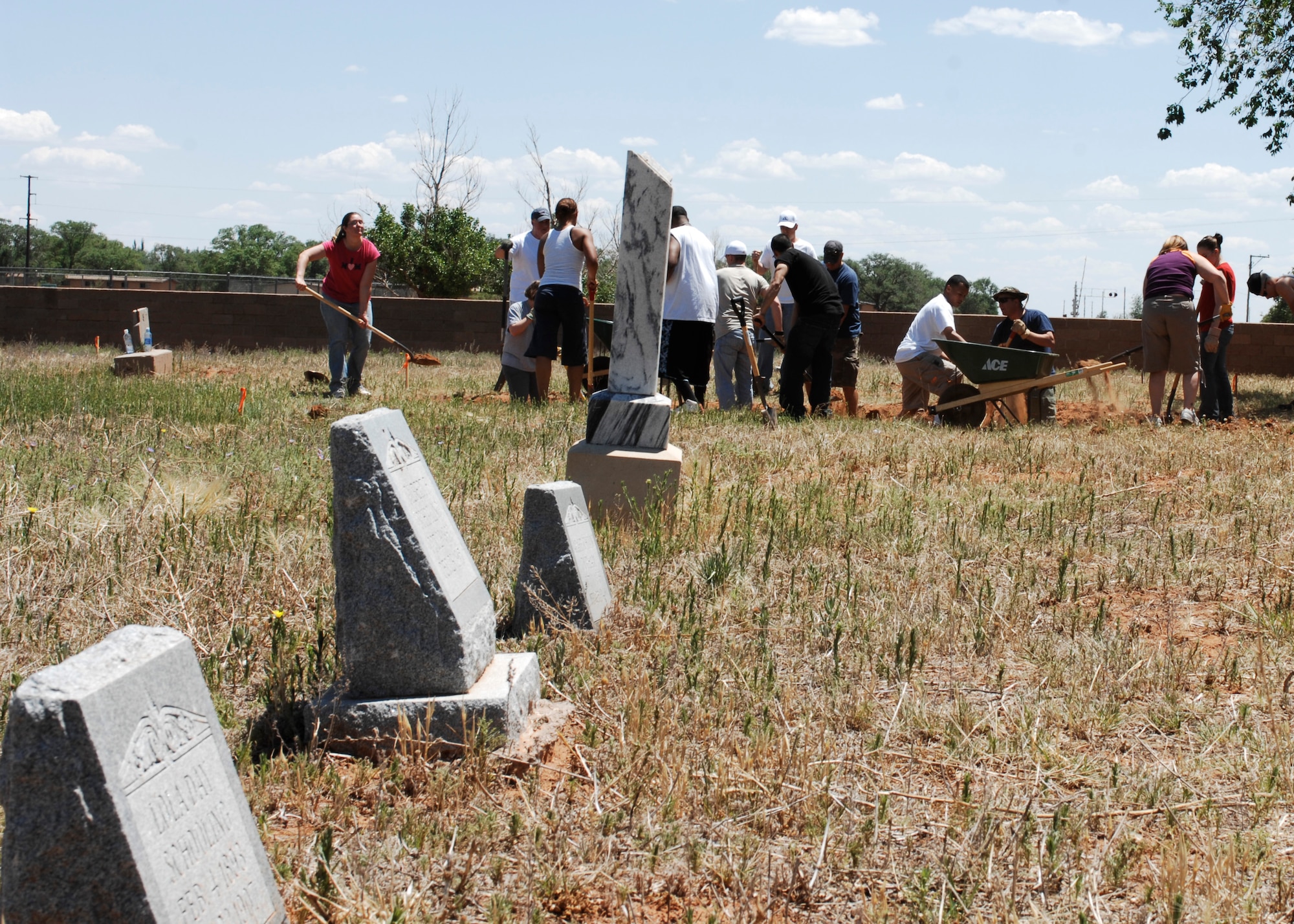 CANNON AIR FORCE BASE, N.M. -- Base Airmen begin an archeological-type dig May 29-30 at Blacktower Cemetery to locate the gravesites OF at least 42 New Mexico pioneers buried there in the early 1900s. Headstones in the foreground don't necessarily indicate gravesite locations as historians believe they were relocated. The restoration project is expected to last until Memorial Day 2010. (U.S. Air Force photo by Greg Allen)