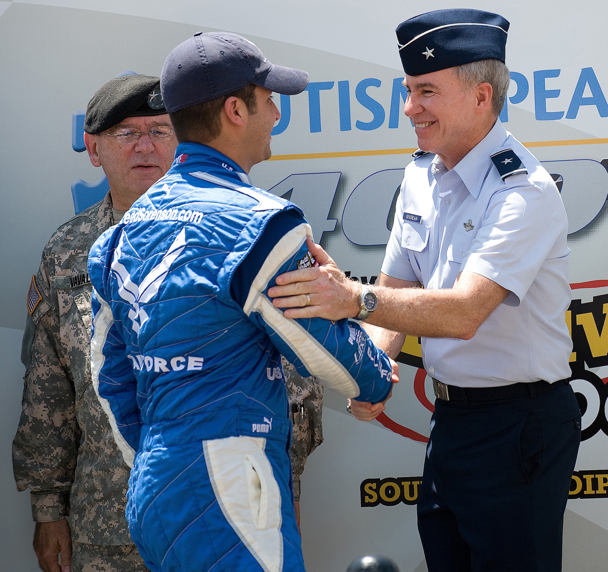 (Right) Brig. Gen. Richard Devereaux, director of Intelligence, Operations and Nuclear Integration, Air Education and Training Command; wishes Reed Sorenson, Air Force sponsored NASCAR driver, good luck before the Autism Speaks 400 May 31.  (U.S. Air Force photo/Jason Minto)