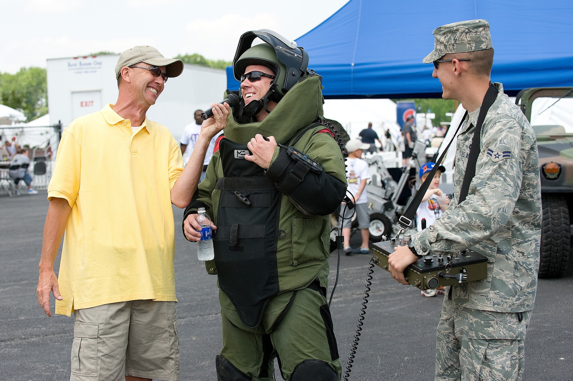 436th Airlift Wing Explosive Ordinance Disposal members (middle) Capt. Patrick Wren and (right) Airman 1st Class Benjamin McGovern are interviewed by an announcer at Dover Downs before the Heluva Good! 200 NASCAR race May 30.  (U.S. Air Force photo/Jason Minto)
