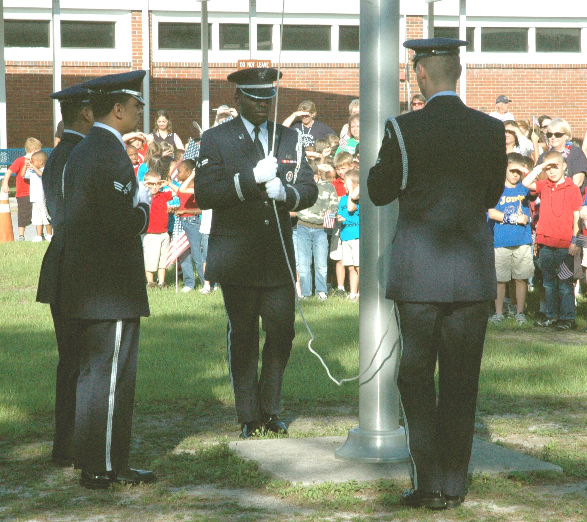 More than 700 children gethered to watch the Tyndall Honor Guard members gathered to ceremoniously raise the American flag May 27, at Tyndall Elementary School, to honor our country and celebrate the children’s last day of school.  
