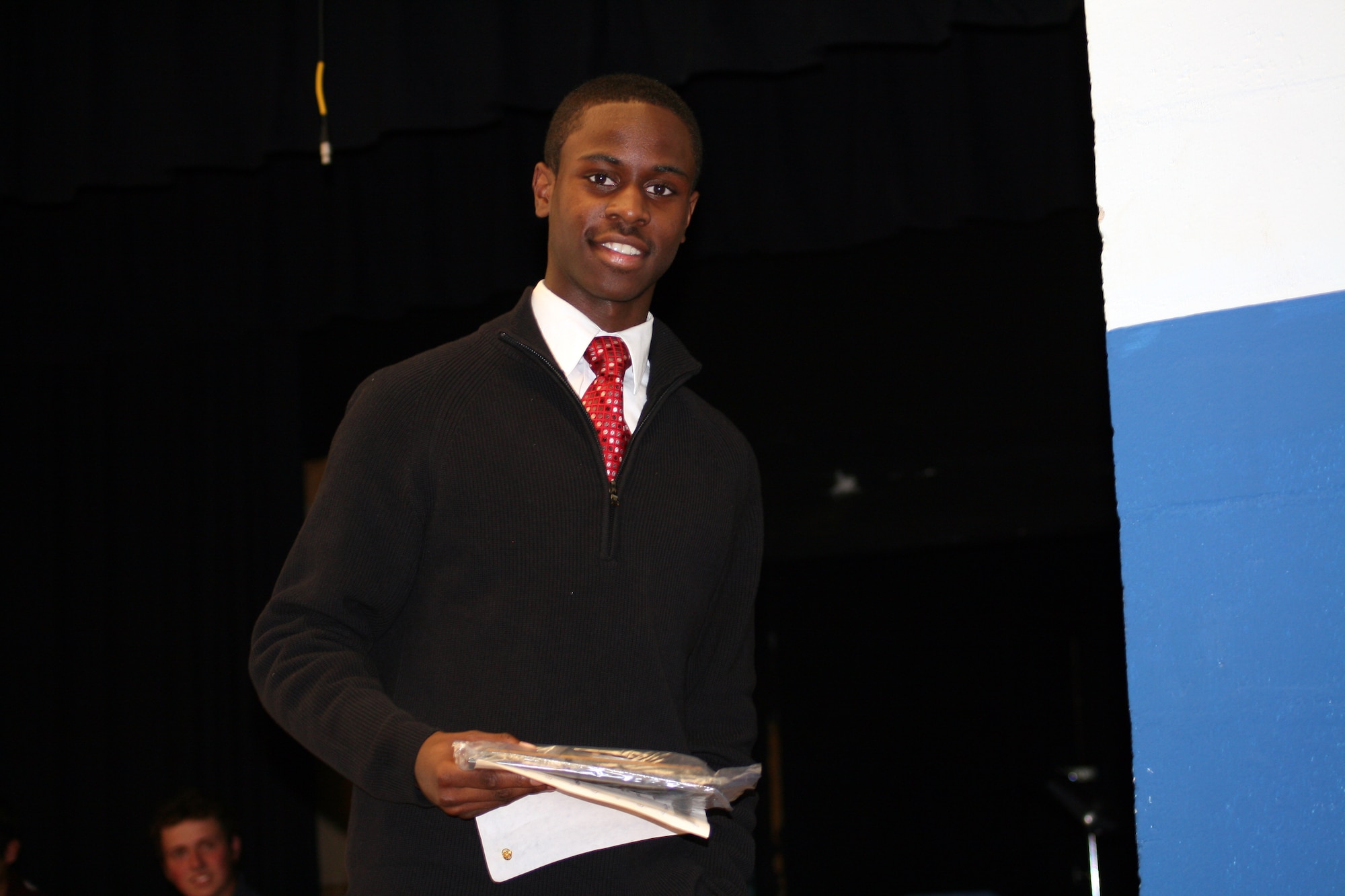 Austinio Brown, a seventh grader at Dover Air Base Middle School, receives recognition for breaking the Caesar Rodney School District record for the 100-meter dash. His time was 11.9 seconds. Team mate Jazmine Lee also broke a district record, completing a 400-meter run in 1 minute, 4 seconds. (U.S. Air Force photo by Vanessa Brown)