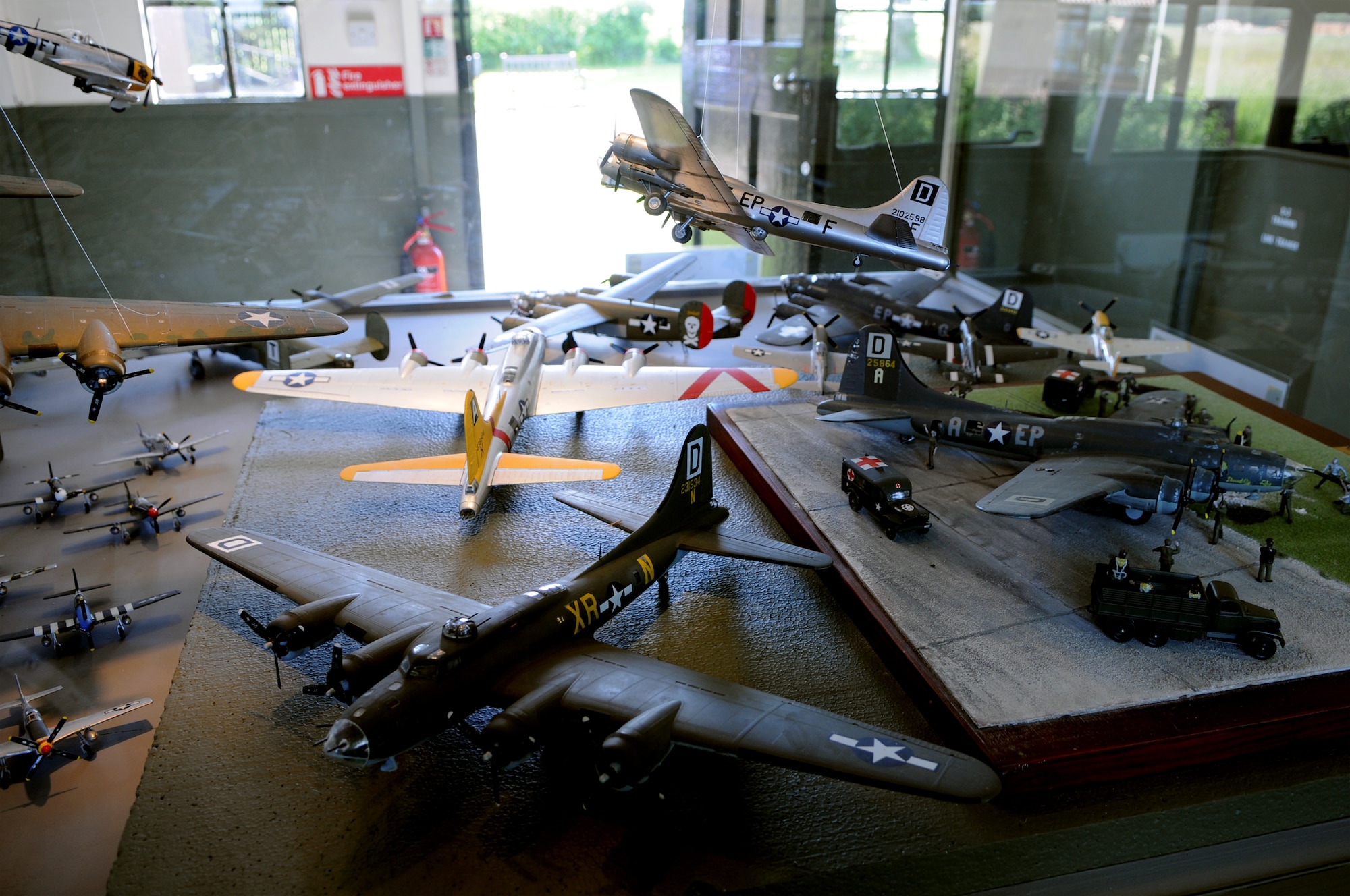 A display of model aircraft, many of which display the same “Box D” insignia on the tail of RAF Mildenhall’s KC-135 fleet, sits in one of several buildings at Thorpe Abbots, the original home of the 100th Bomb Group in World War II.  The airfield and its buildings have been transformed into a museum dedicated to World War II aviation.  (U.S. Air Force photo by Staff Sgt. Austin M. May)