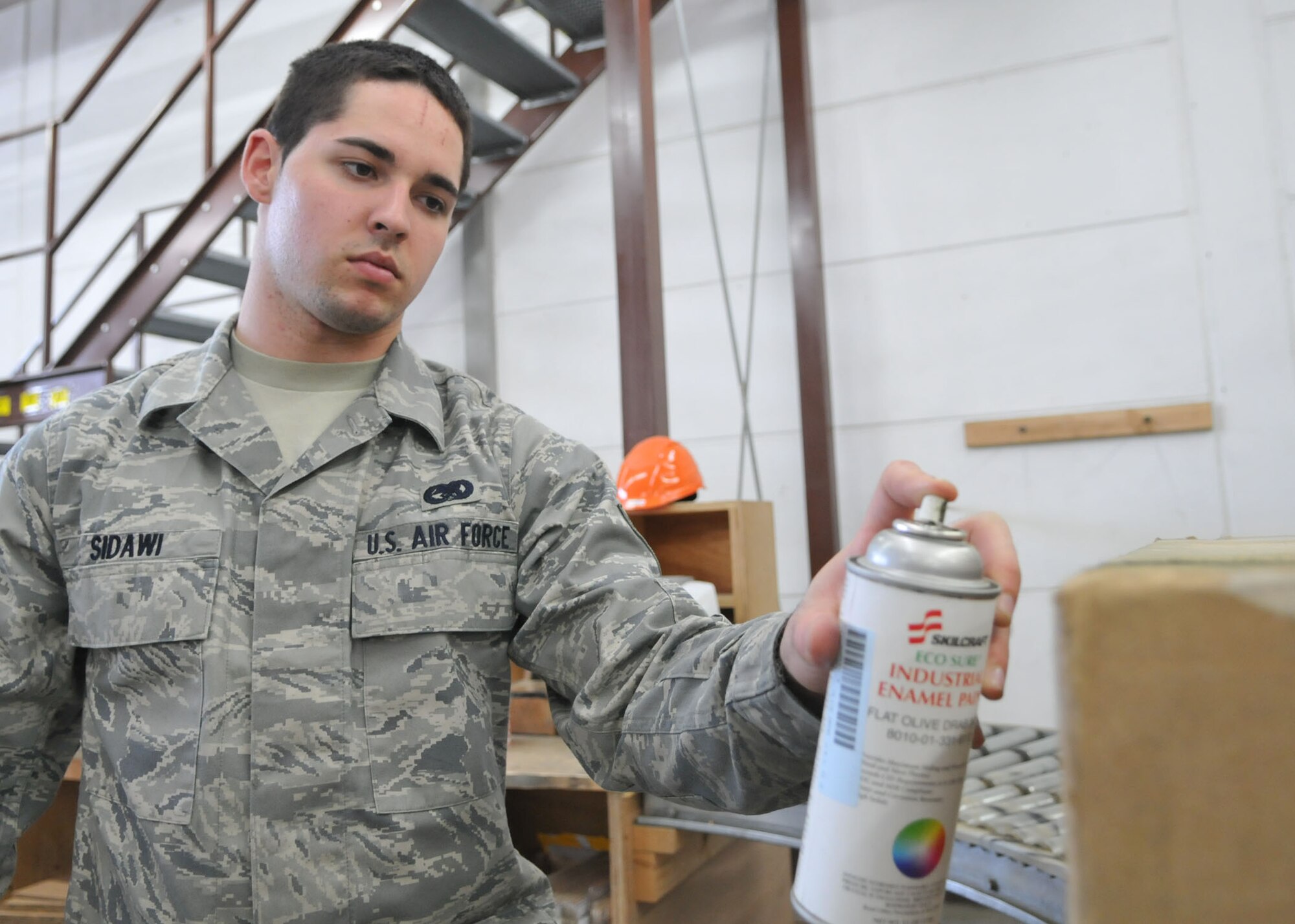 SPANGDAHLEM AIR BASE, Germany – Airman 1st Class Ryan Sidawi, 52nd Logistics Readiness Squadron travel management office, prepares  cargo for out-processing and shipment. The TMO office is open 8 a.m. – 4 p.m. Monday through Friday. (U.S. Air Force photo by Airman 1st Class Nick Wilson)