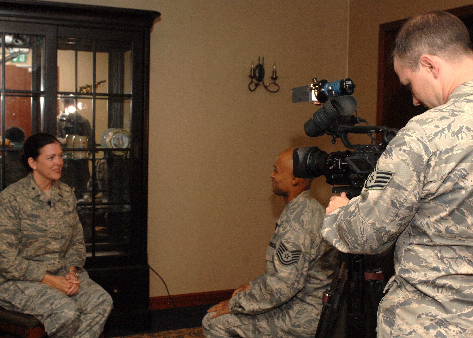 SPANGDAHLEM AIR BASE, Germany -- Brig. Gen. Theresa M. Casey, assistant surgeon general for modernization, Office of the Air Force Surgeon General, is interviewed by Tech. Sgt. John Anderson and Staff Sgt. Jared Frey, Armed Forces Network broadcaster May 27, 2009. General Casey visited with members of the 52nd Medical Group. (U.S Air Force photo by Senior Airman Jenifer H. Calhoun)