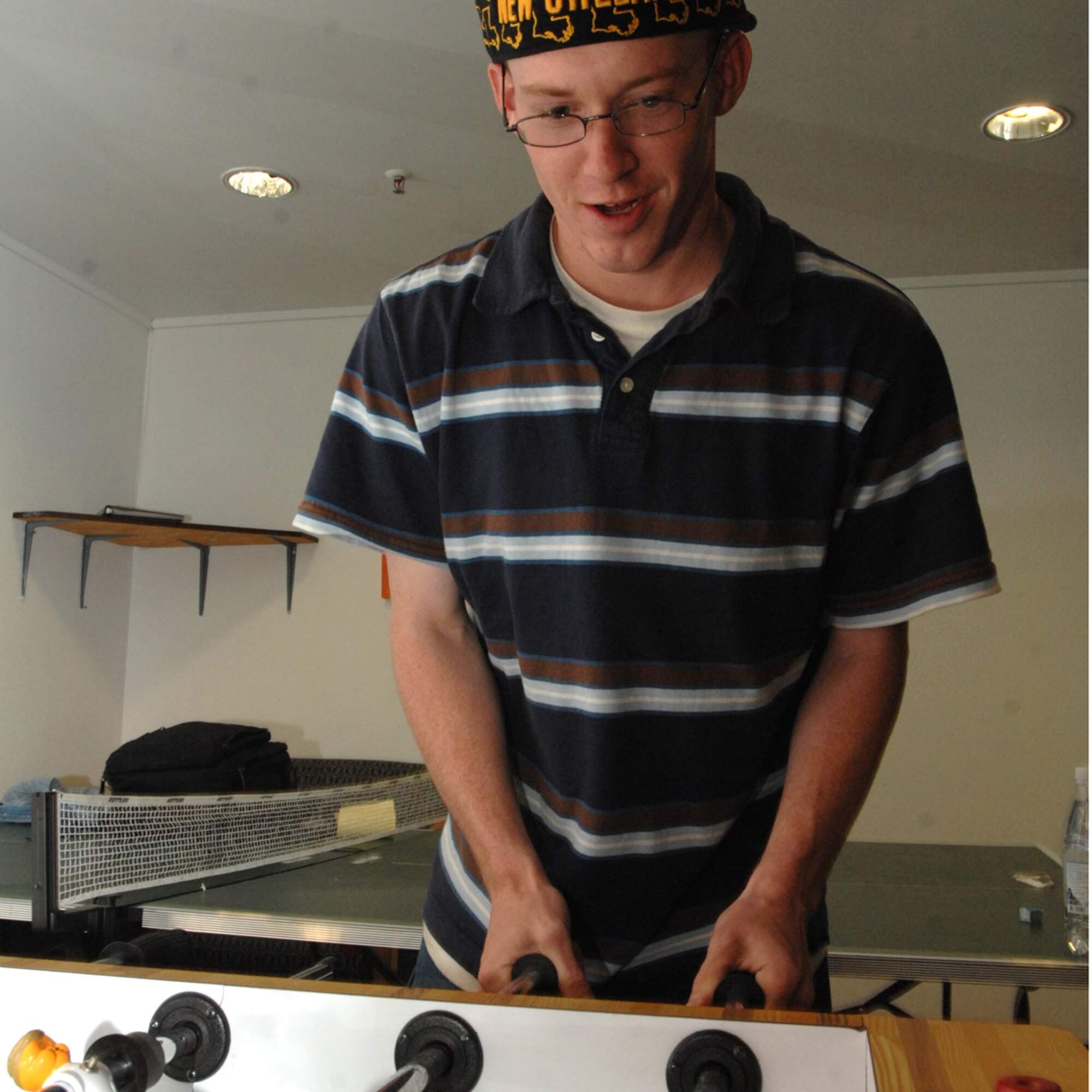 SPANGDAHLEM AIR BASE, Germany – Airman 1st Class Jeremy Johnston, 52nd Security Forces Squadron, plays foosball in a dormitory here May 27, 2009. Airman Johnston enjoys playing billiards and foosball when not on duty, he said.  (U.S. Air Force photo by Senior Airman Jenifer H. Calhoun