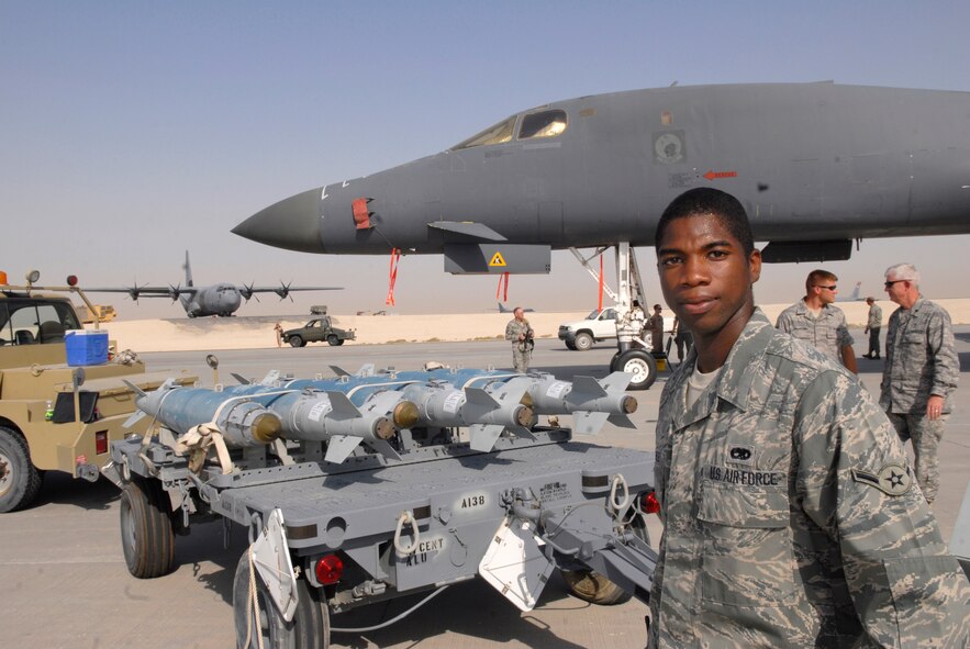 Airman Deon Bigbee, a 379th Expeditionary Maintenance Squadron munitions journeyman, stands by to talk about munitions and their use, during Flightline Fest, May 29, 2009, at an undisclosed location in Southwest Asia.  The 379th Air Expeditionary Wing hosted the half day event which gave base personnel the chance to look at static aircraft displays and other equipment up close, all without interrupting the mission of providing combat airpower throughout the U.S. Central Command's area of responsibility.  Airman Bigbee hails from Columbus, Miss and is deployed from Dyess Air Force Base, Texas in support of Operations Iraqi and Enduring Freedom and Combined Joint Task Force - Horn of Africa.  (U.S. Air Force photo/Senior Airman Andrew Satran/released)